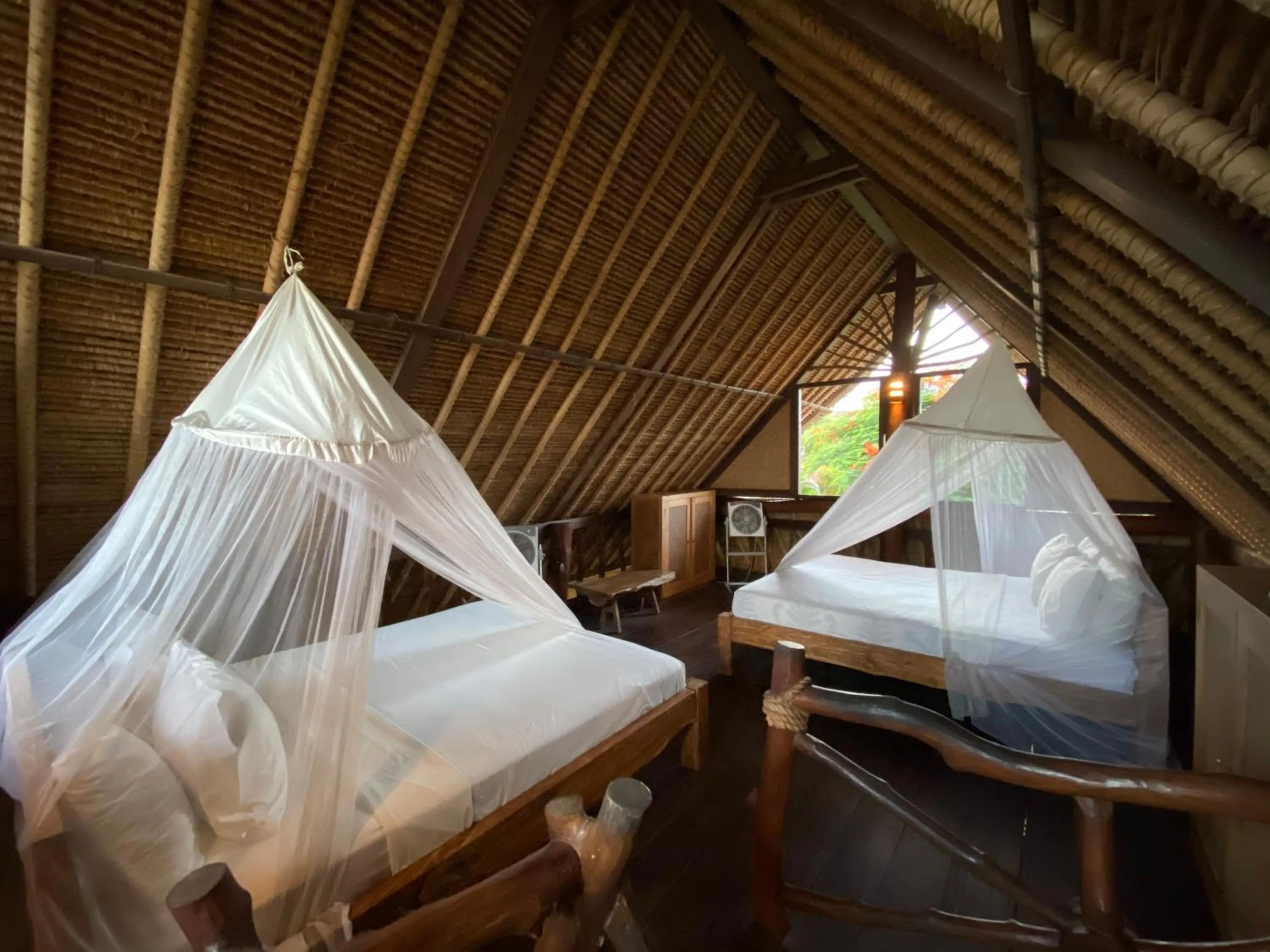 Bed in Flower Bud Bungalow Balangan