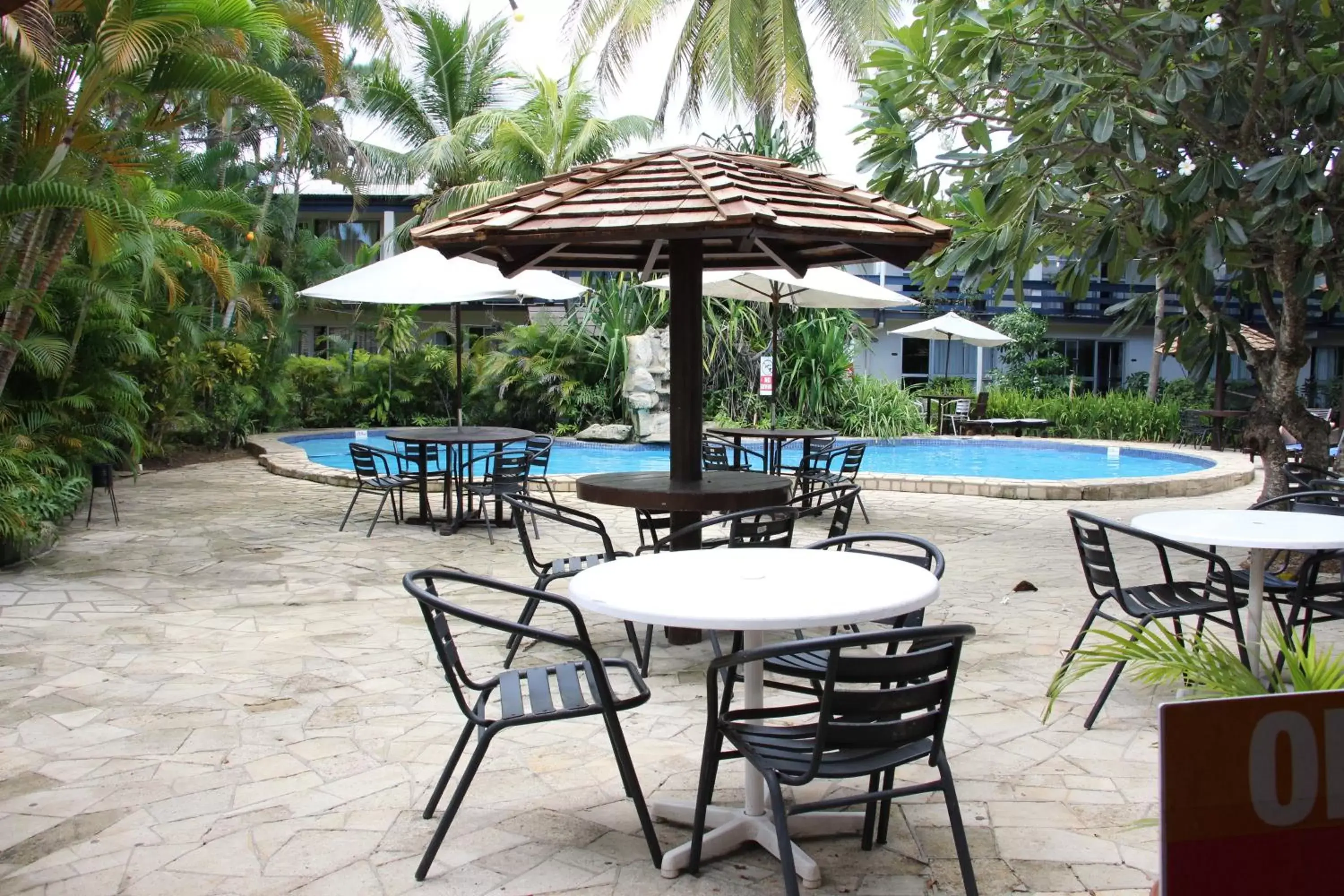 Patio, Swimming Pool in Capricorn International Hotel