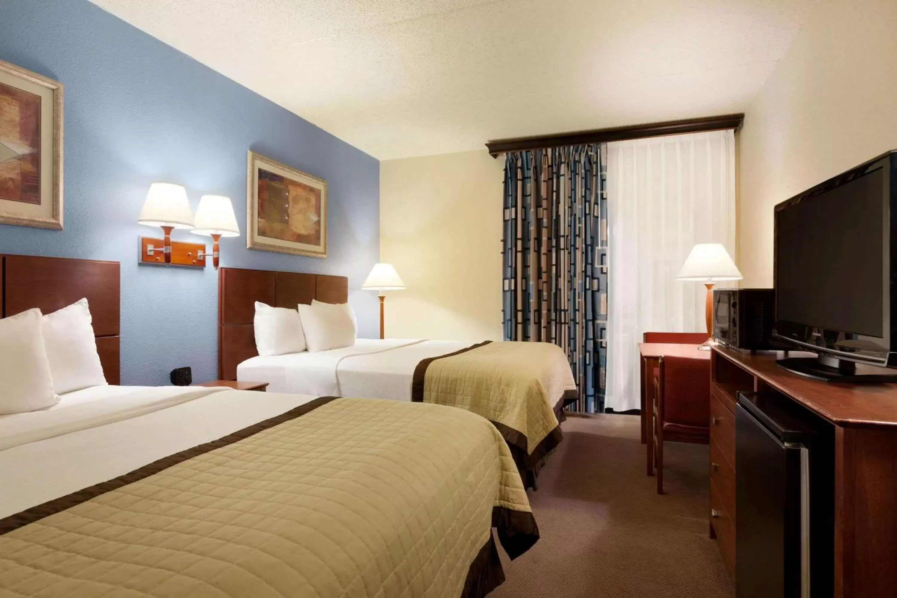 Photo of the whole room, Bed in Ramada by Wyndham Fargo