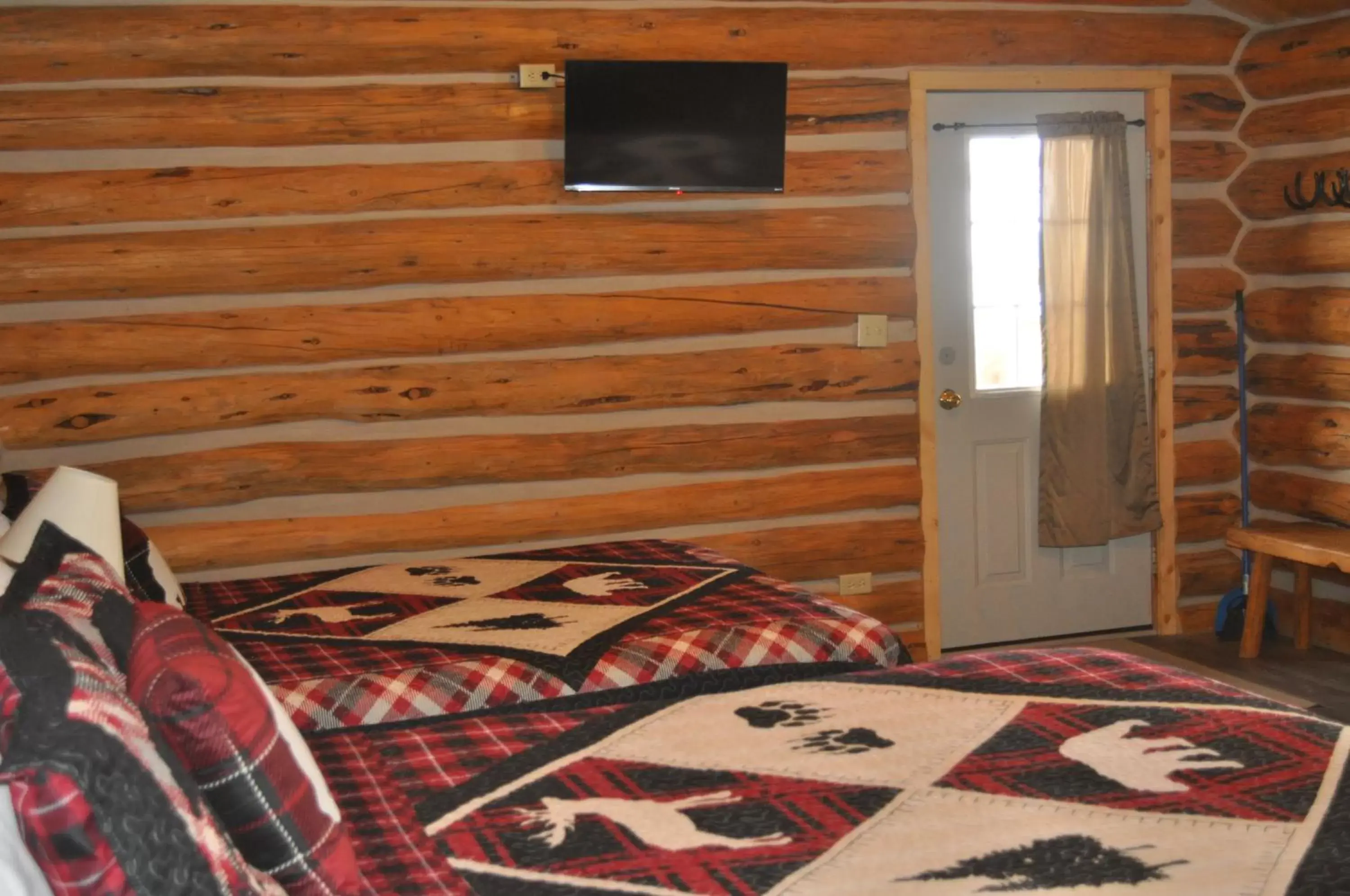 Bed, TV/Entertainment Center in Crooked Creek Guest Ranch