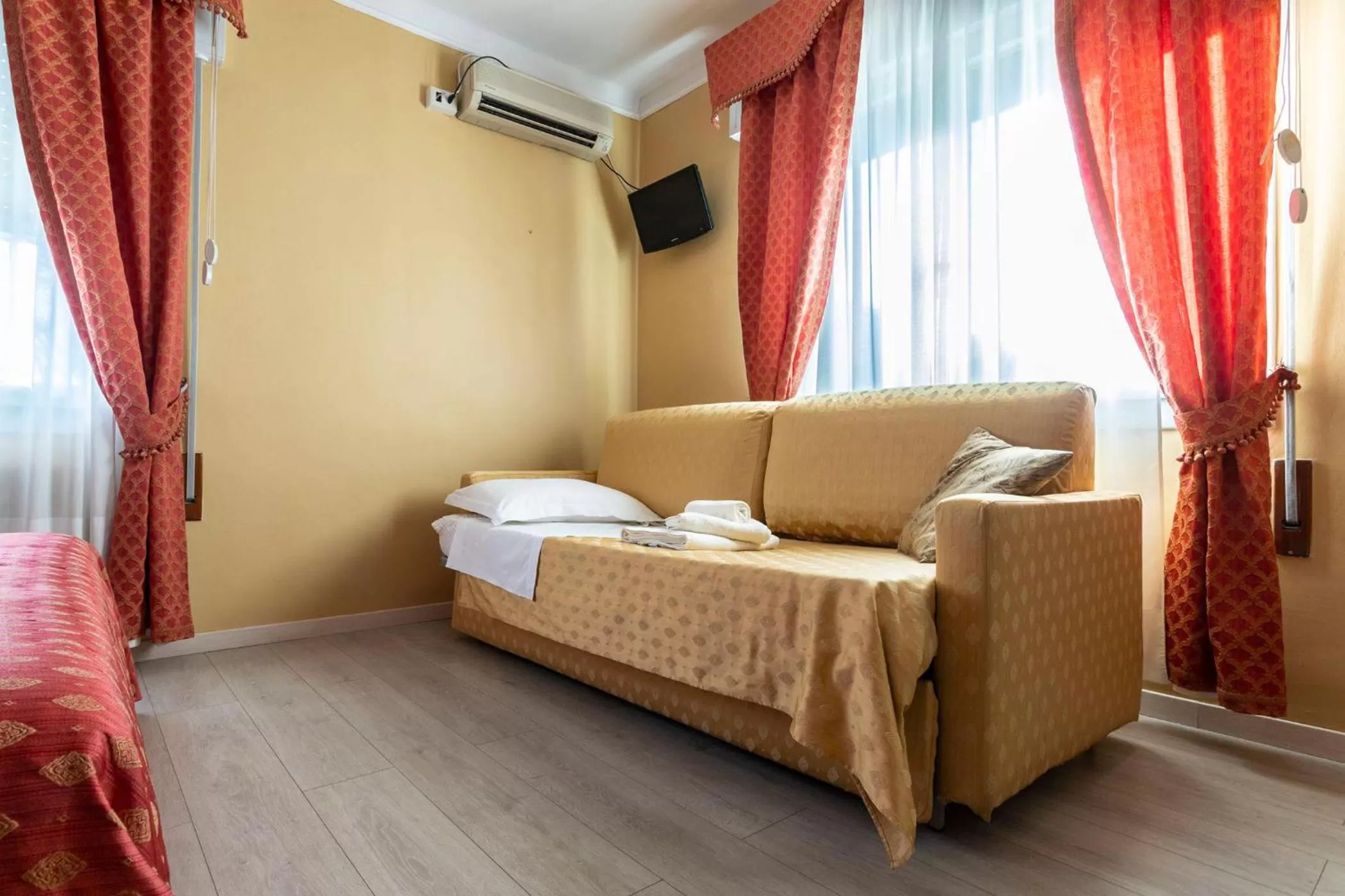 Seating area, Bed in La Bauta