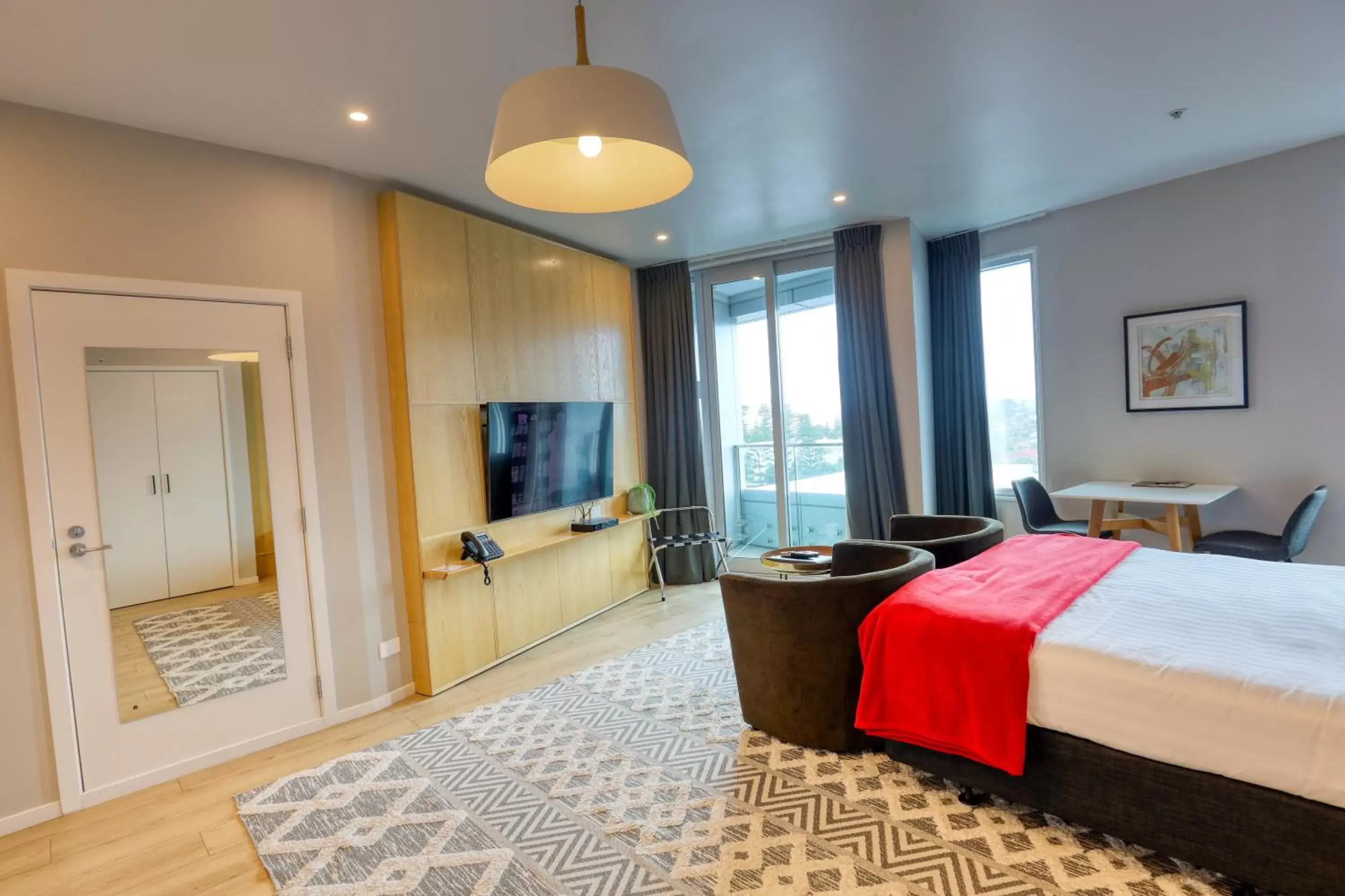 Bedroom in Ramada Suites by Wyndham Nautilus Orewa
