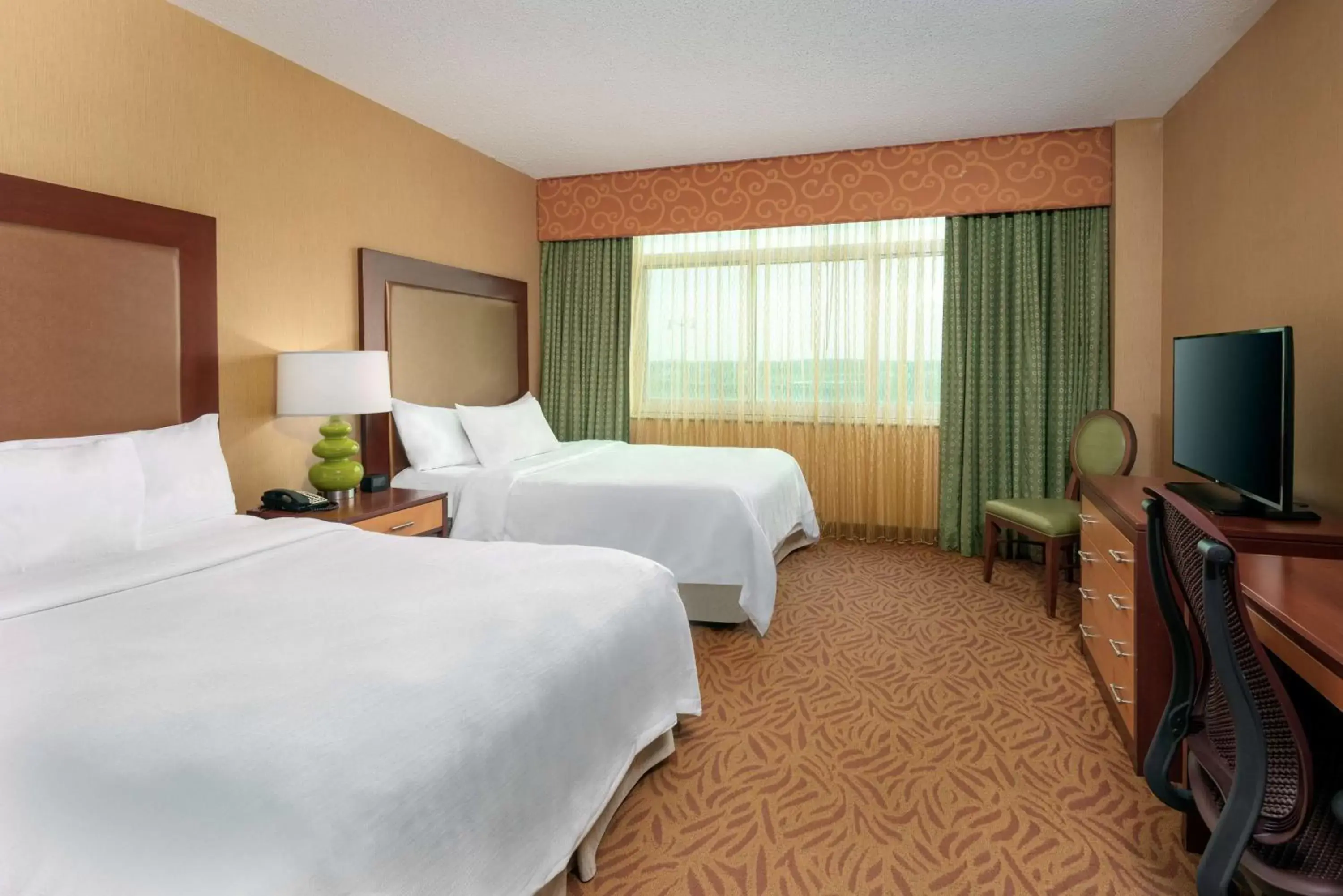 Bedroom in Embassy Suites Omaha- La Vista/ Hotel & Conference Center