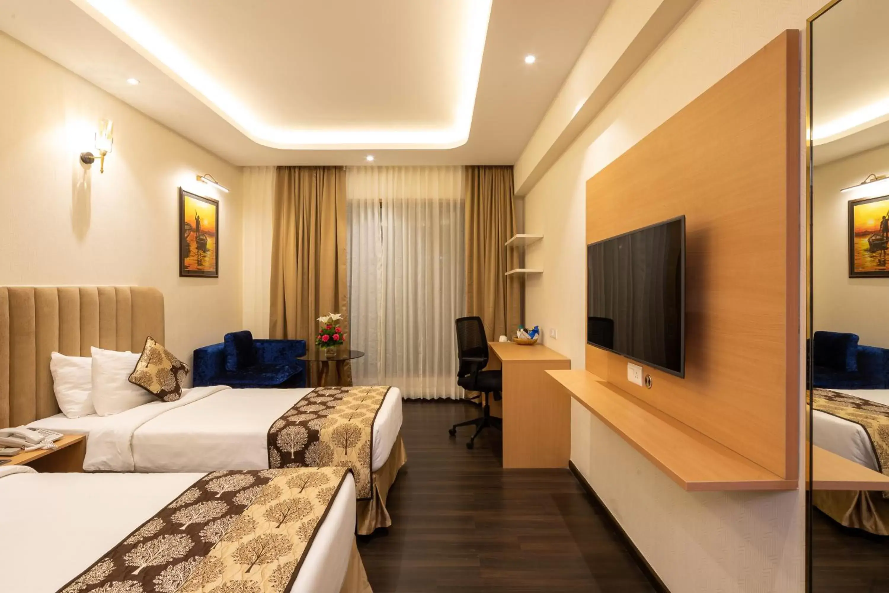 Photo of the whole room, TV/Entertainment Center in Goldfinch Hotel Mangalore