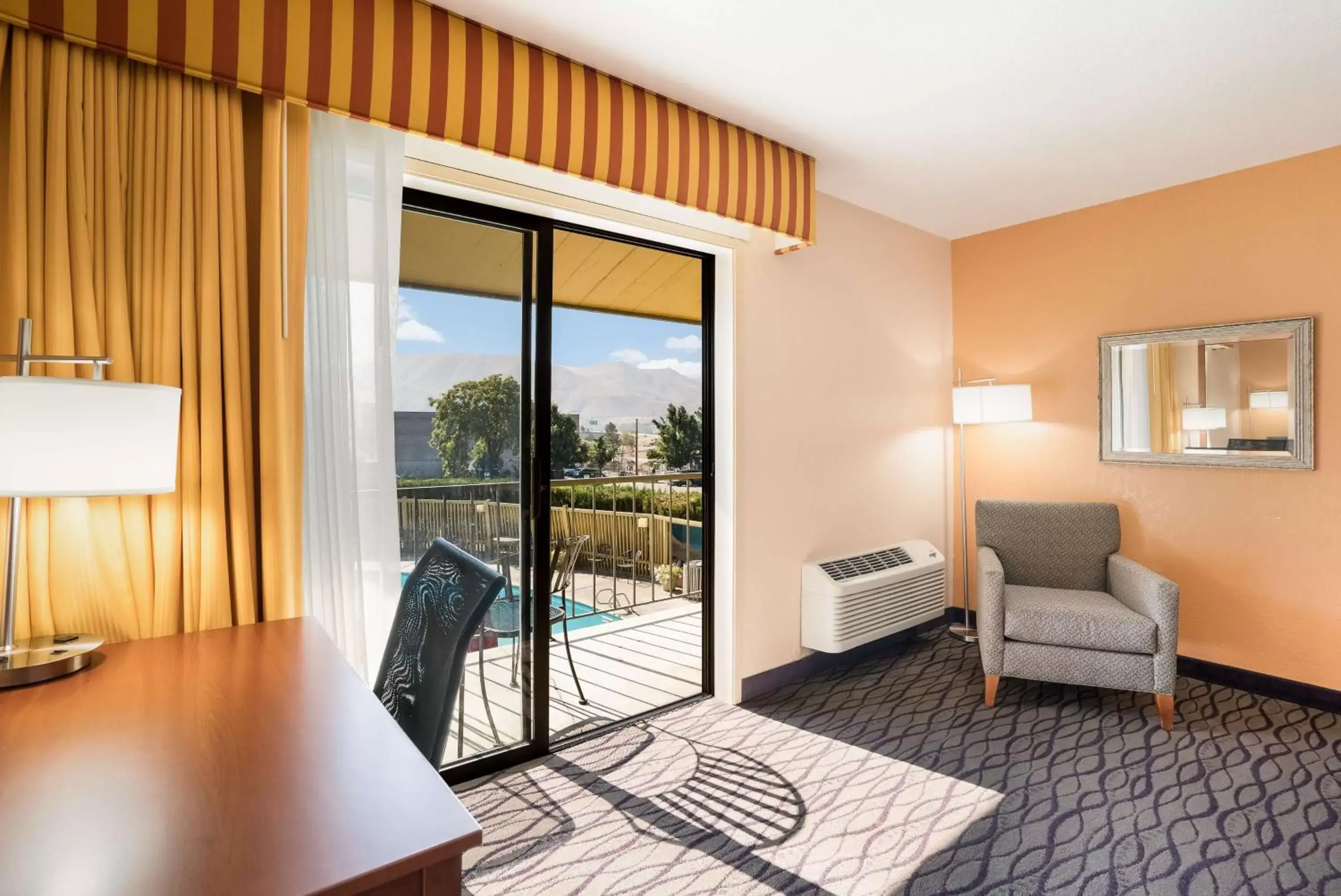 Pool view, Seating Area in SureStay Hotel by Best Western Wenatchee