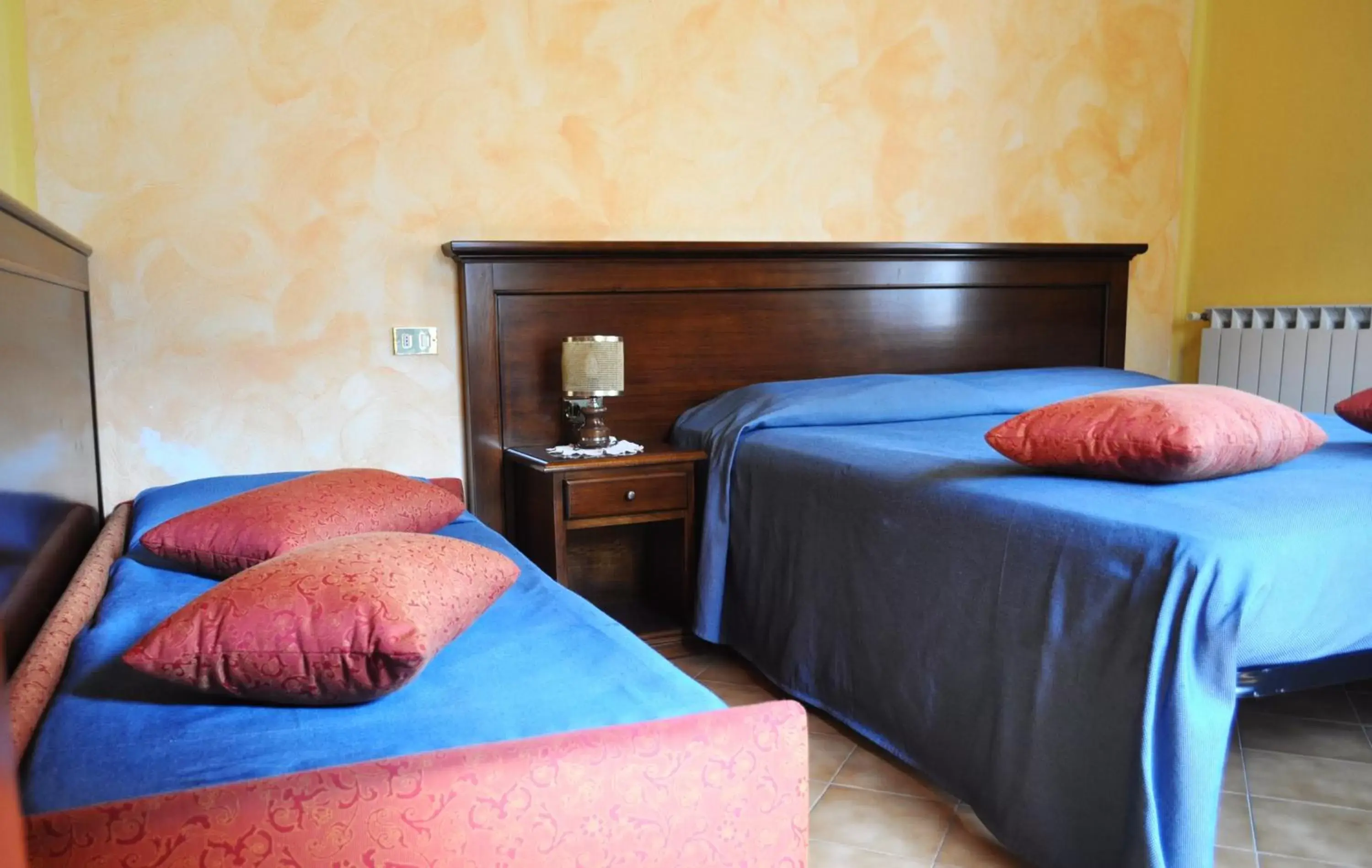 Bed in Albergo Miramonti