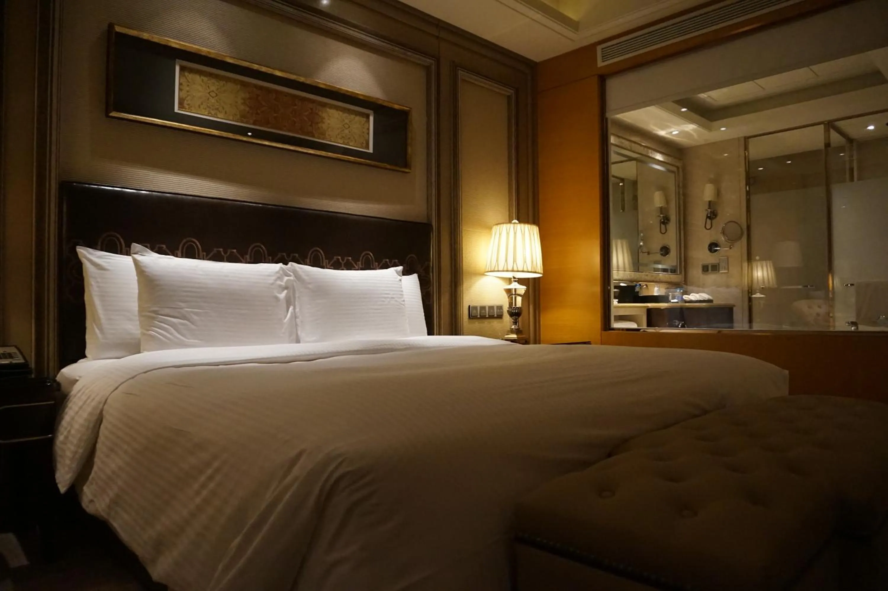 Bed in Wanda Realm Harbin Hotel