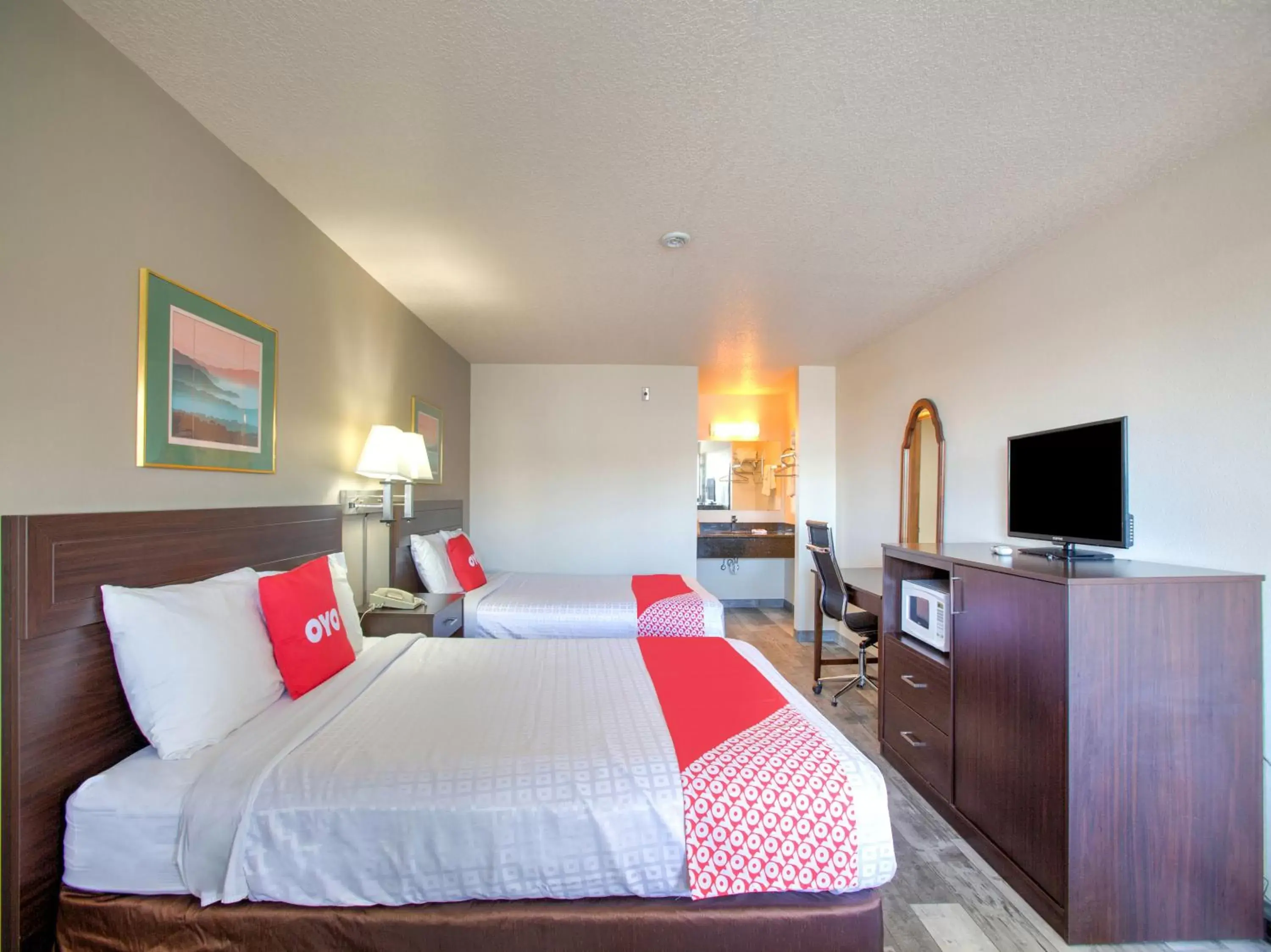 Bedroom, Bed in OYO Woodland Hotel and Suites