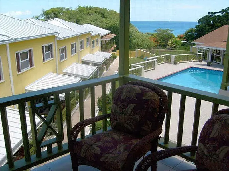 Balcony/Terrace, Pool View in Grooms Beach Villa & Resort