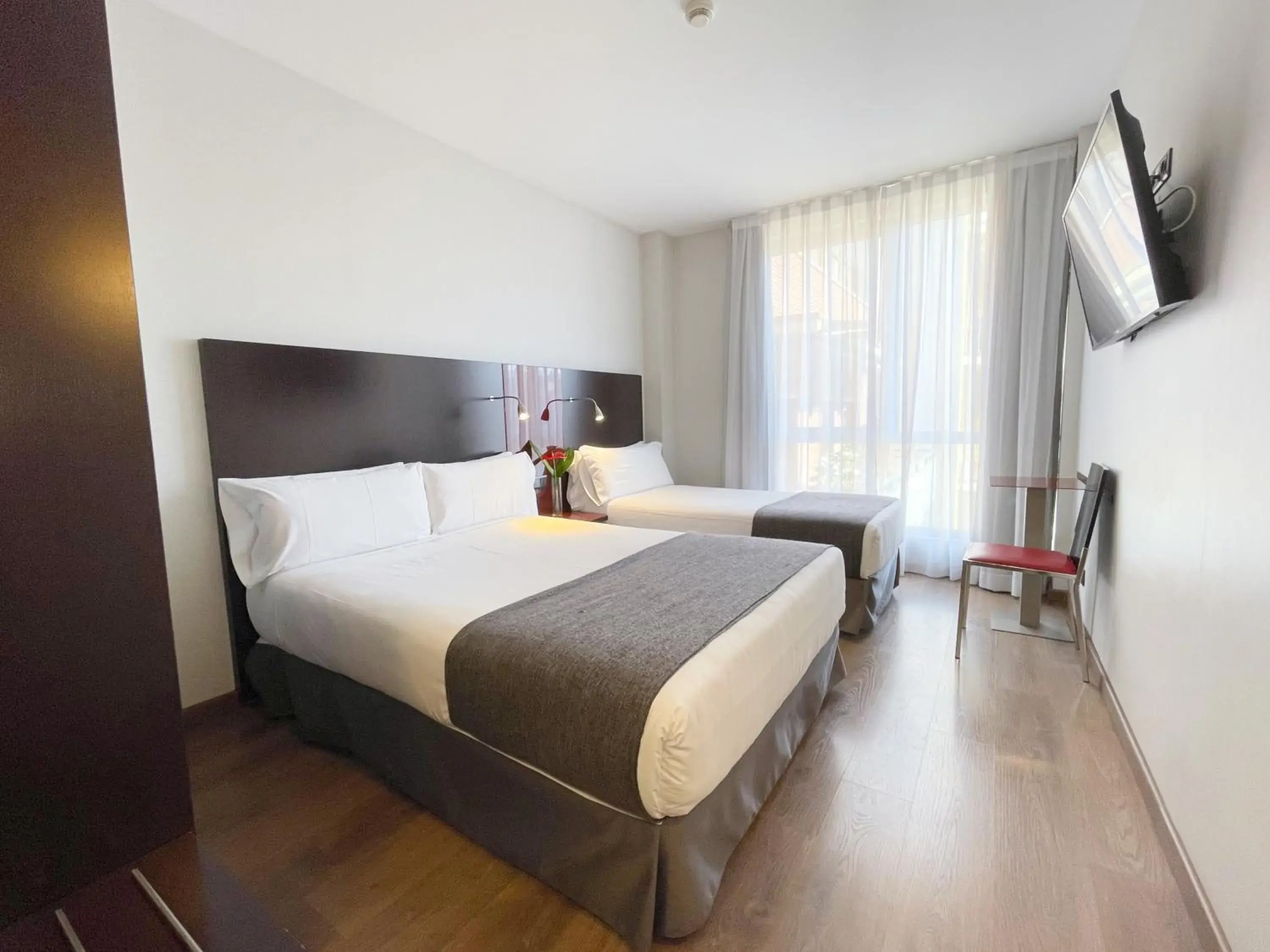 Communal lounge/ TV room, Bed in Sm Hotel Sant Antoni