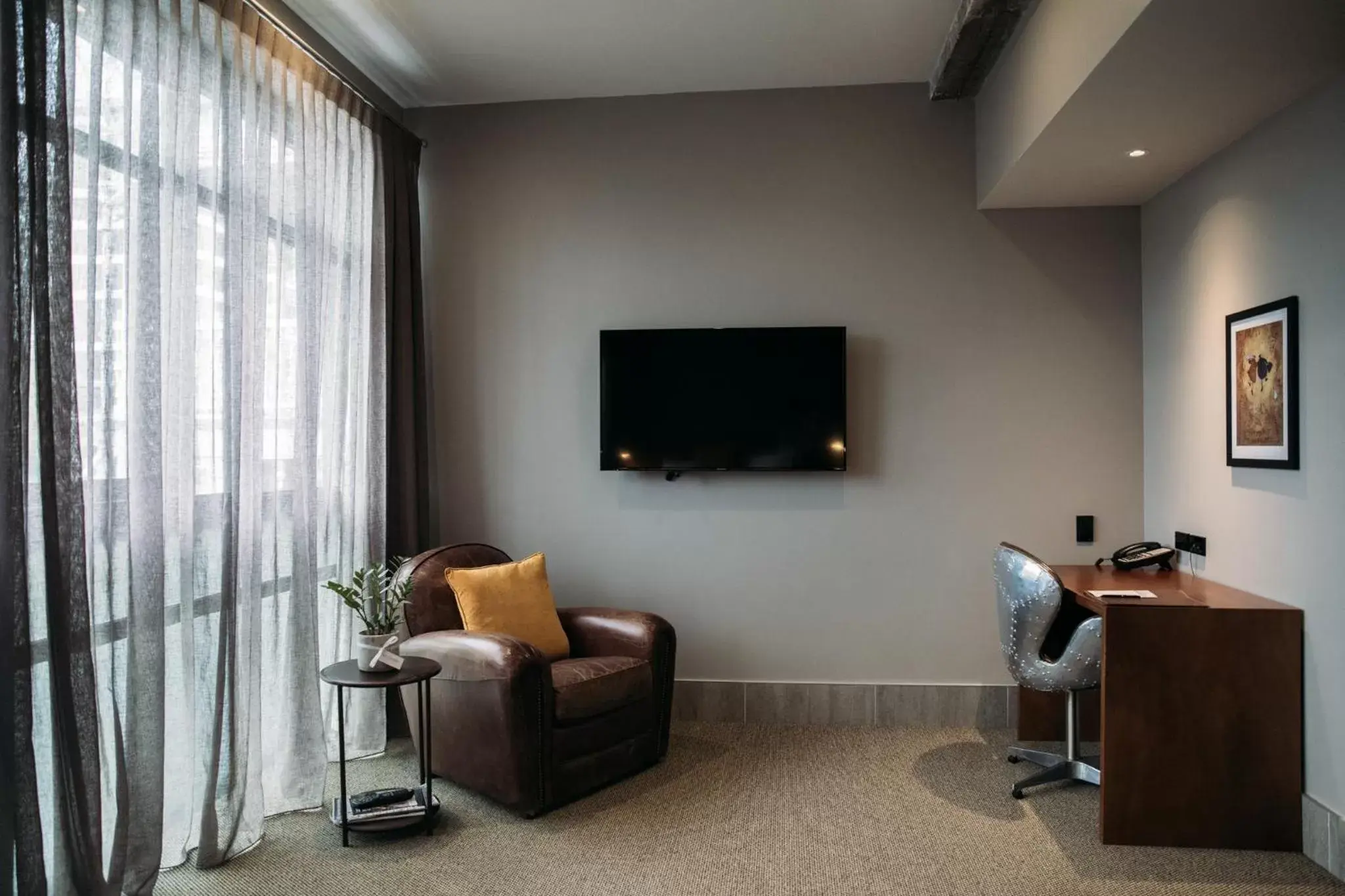 Living room, TV/Entertainment Center in King and Queen Hotel Suites