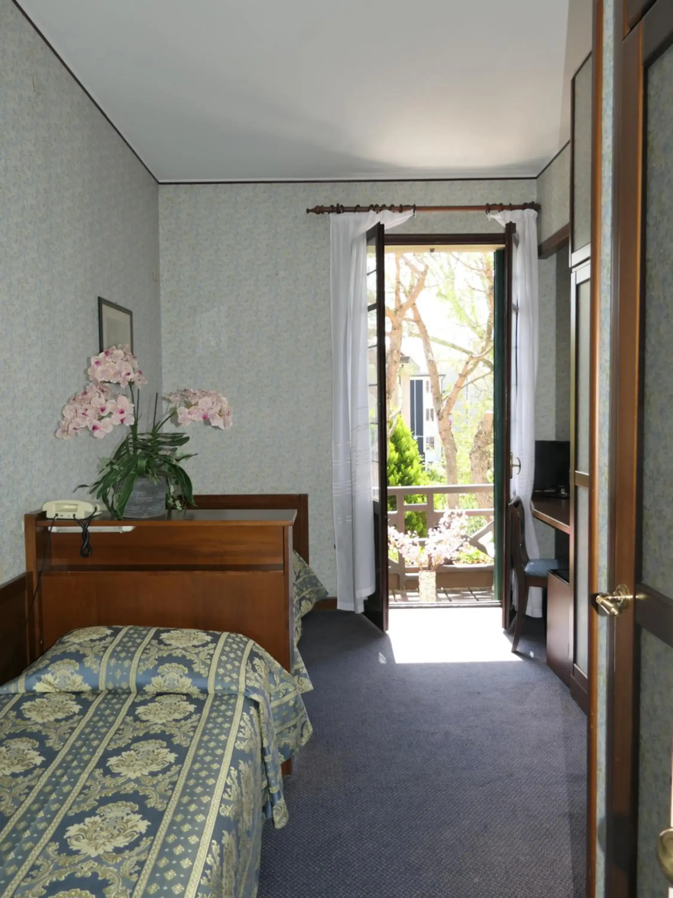 Bedroom in Hotel La Meridiana