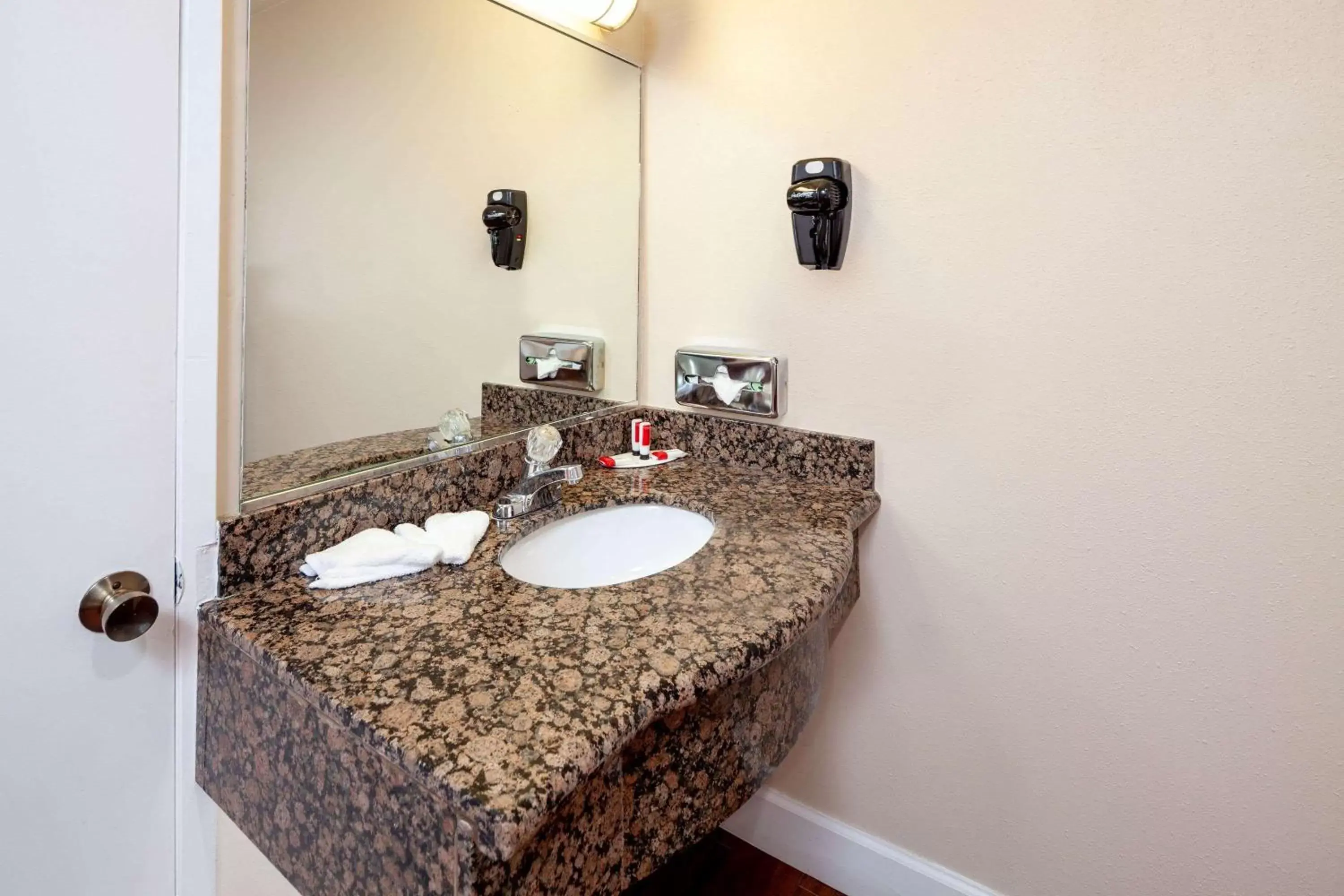 Bathroom in Travelodge by Wyndham Harbor City