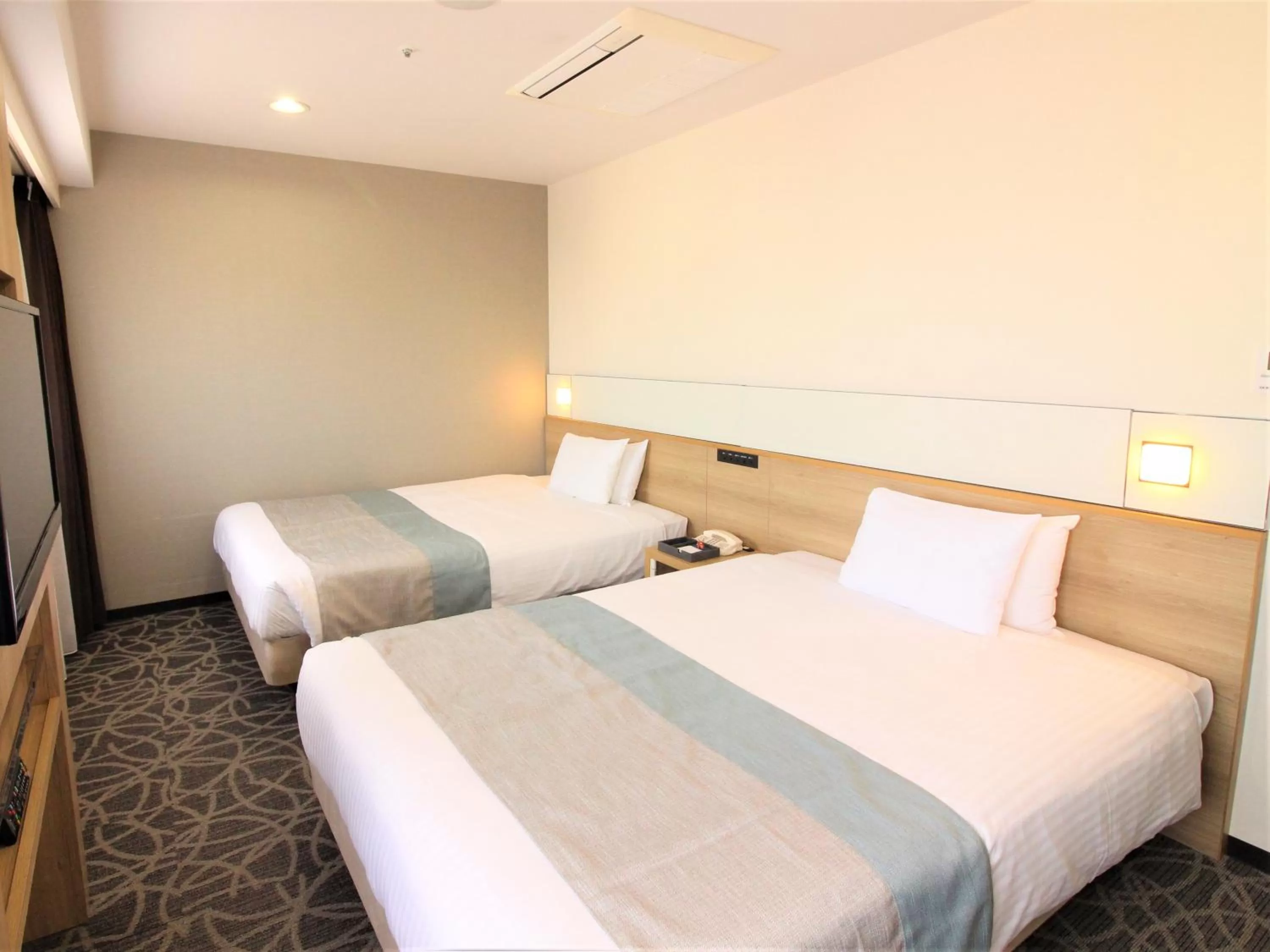 Bedroom, Bed in Hotel Hokke Club Naha Shintoshin