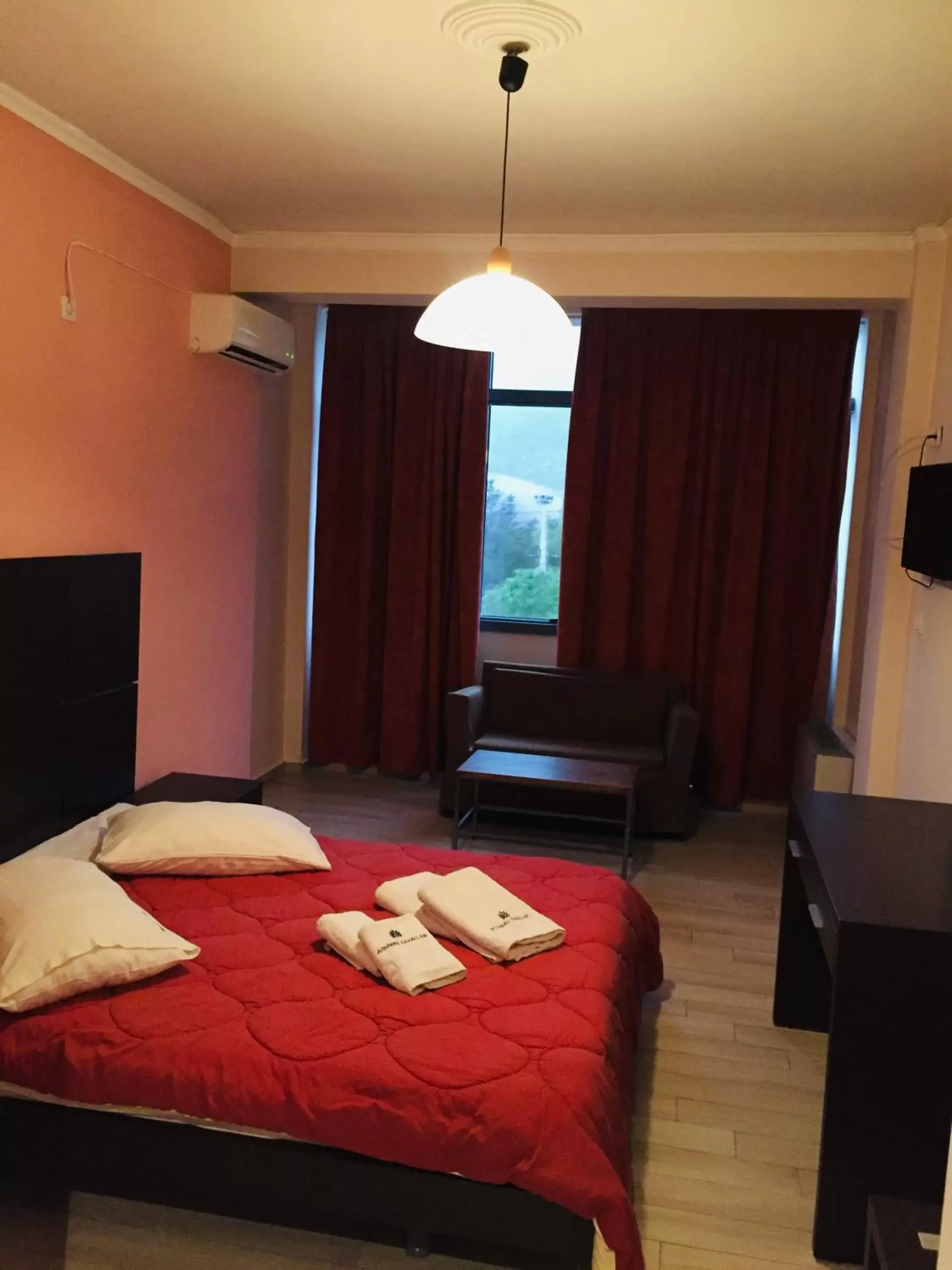 Bed in Acharnis Kavallari Hotel Suites