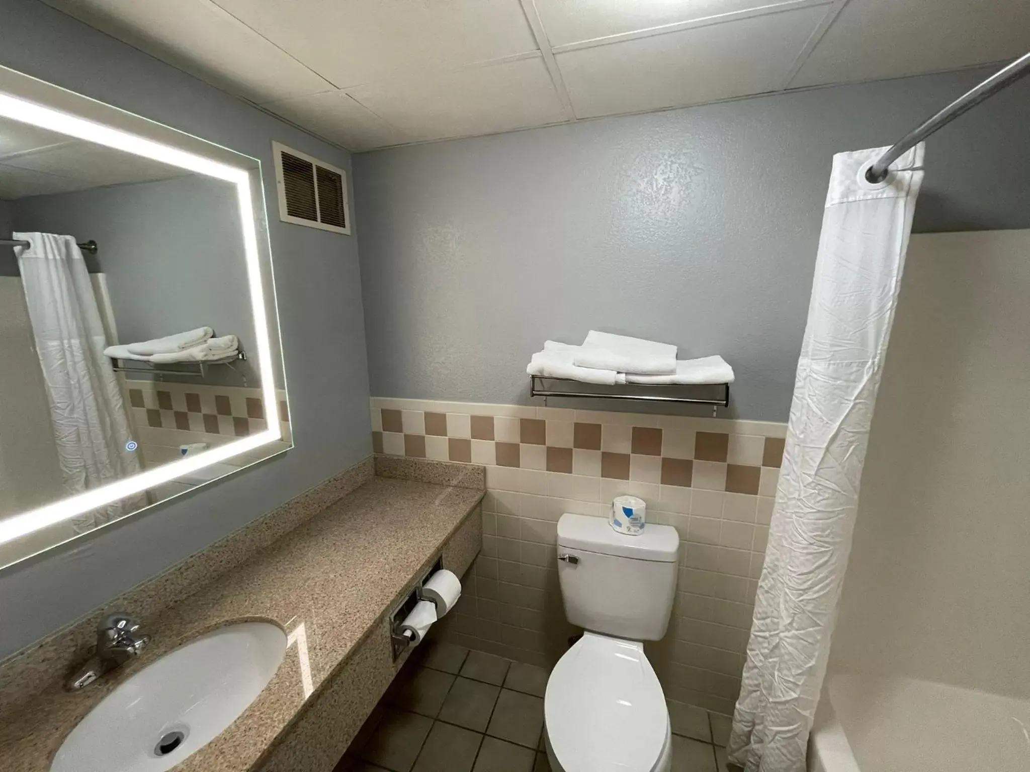 Bathroom in AmericInn by Wyndham Sayre