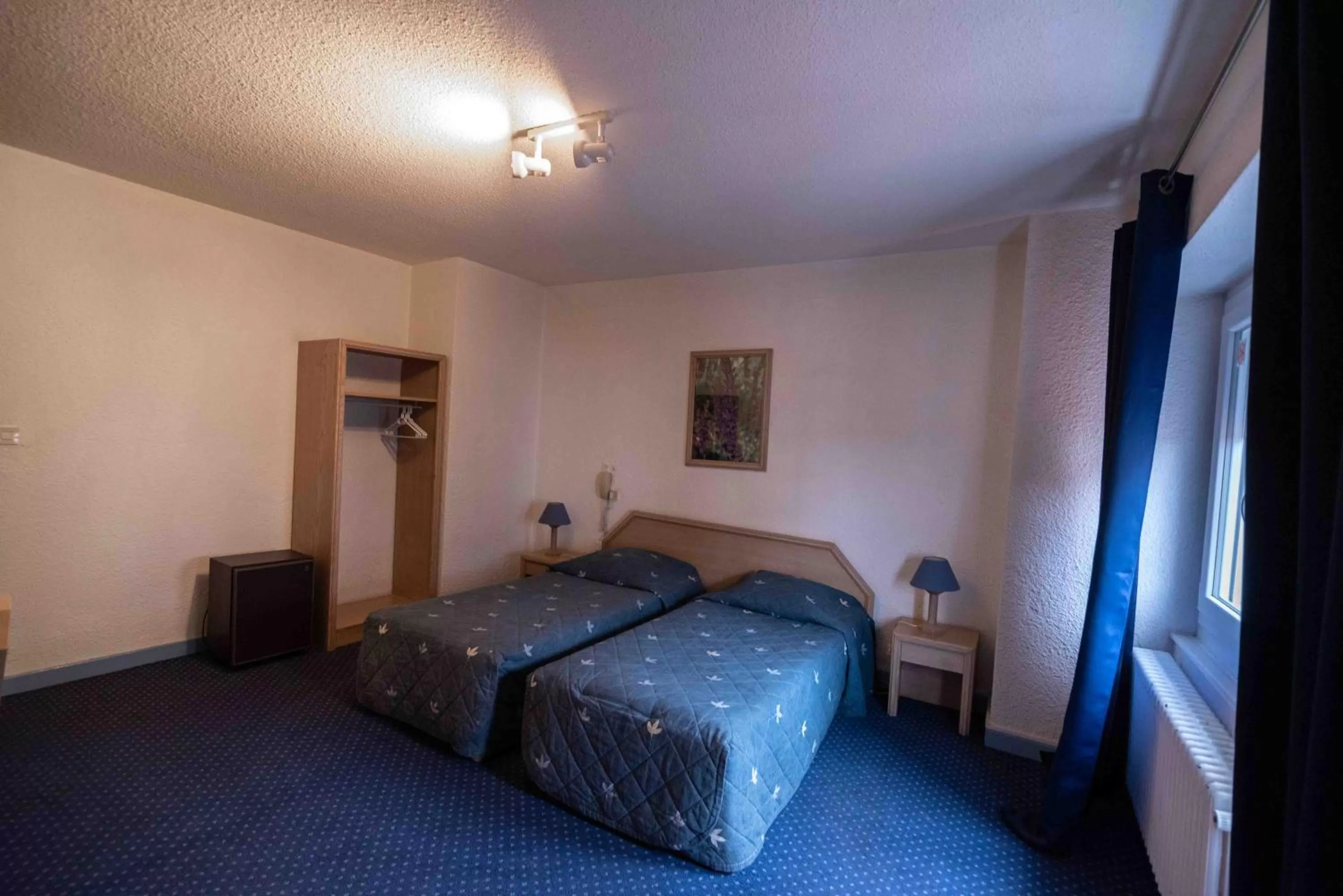 Photo of the whole room, Bed in Hôtel de La Poste