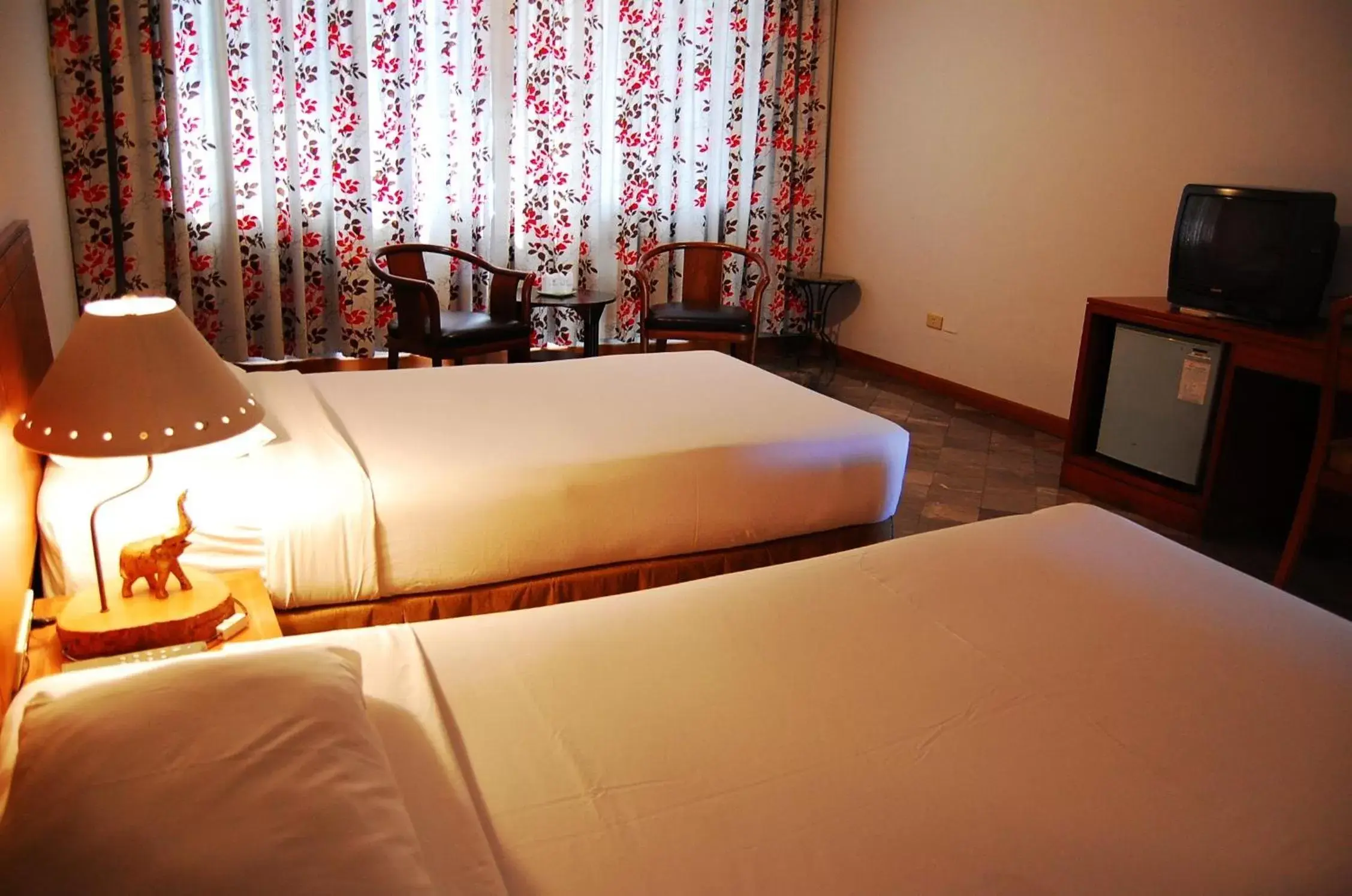 Bed in Royal Lanna Hotel