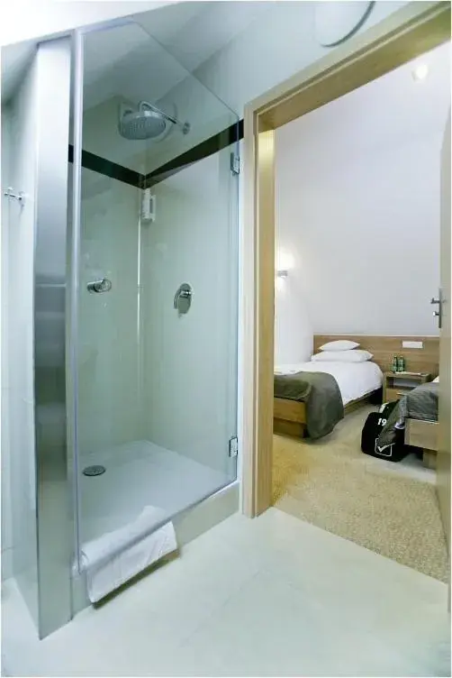 Bed, Bathroom in Rado Resort Spa & Wellness