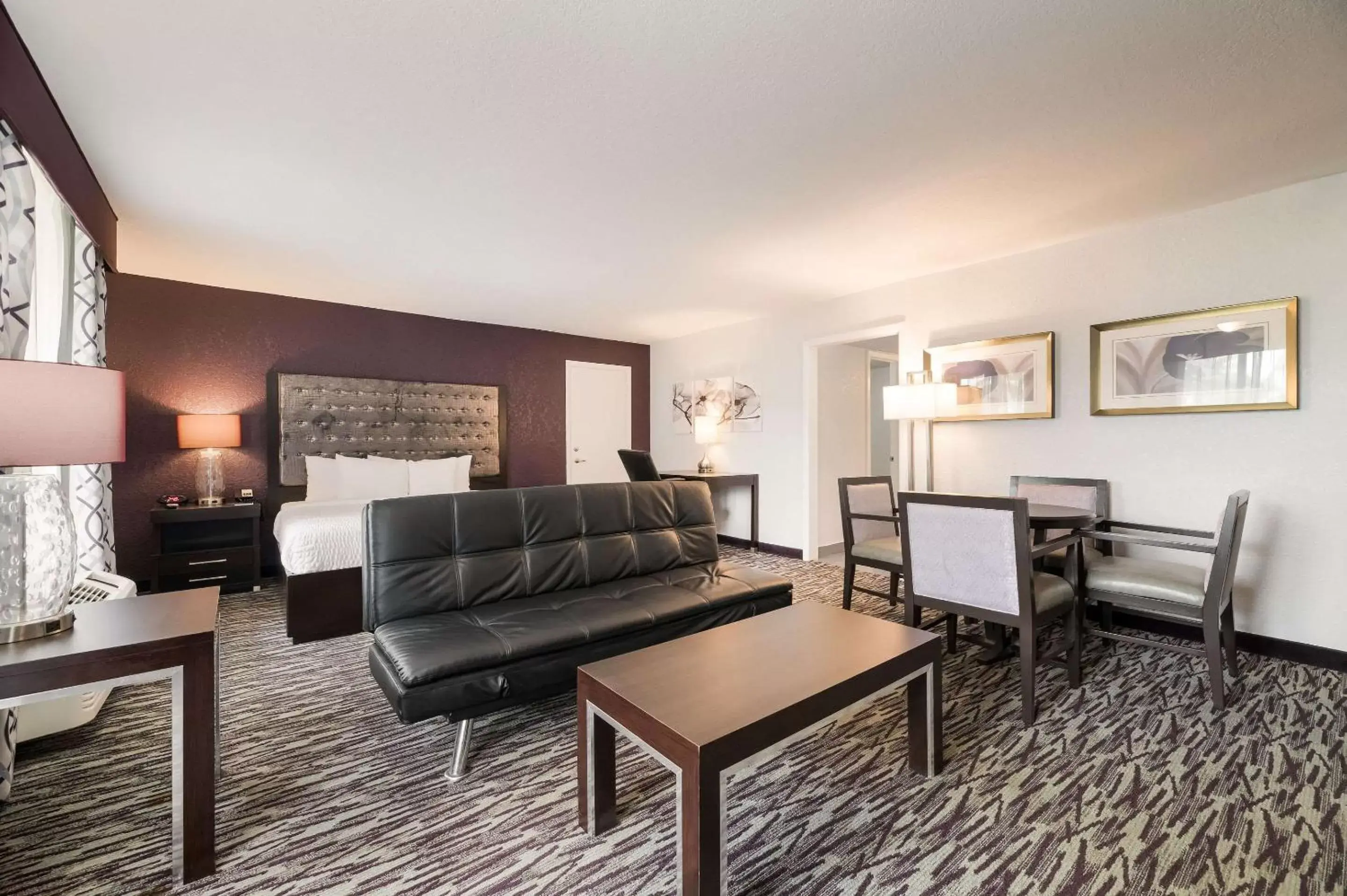 Bedroom, Seating Area in Clarion Inn & Suites Across From Universal Orlando Resort