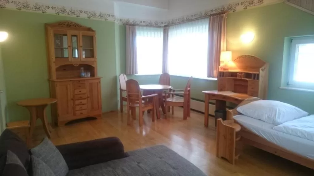 Living room, Bed in Hotel Haus Linden