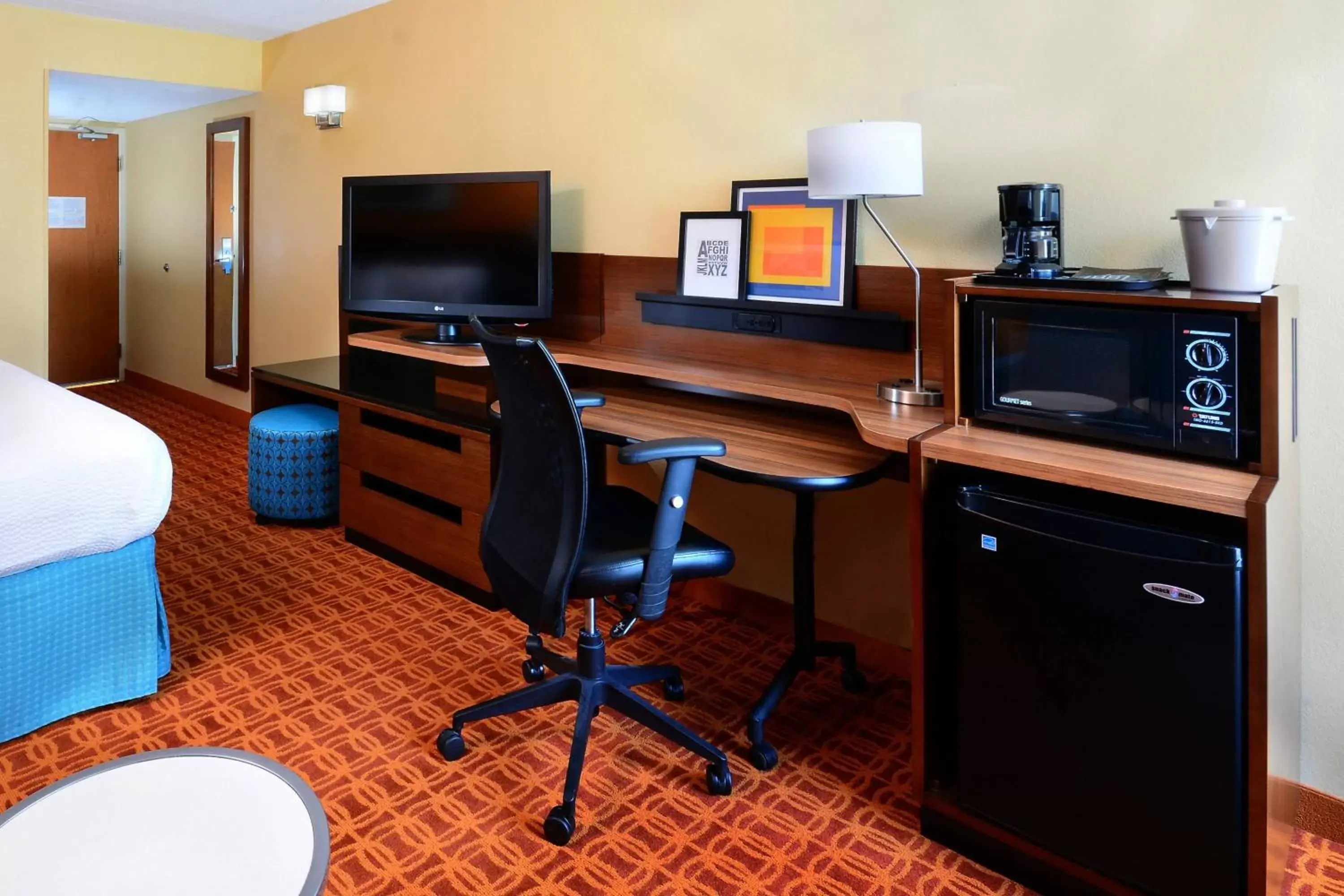 Photo of the whole room, TV/Entertainment Center in Fairfield Inn and Suites by Marriott Winston Salem/Hanes