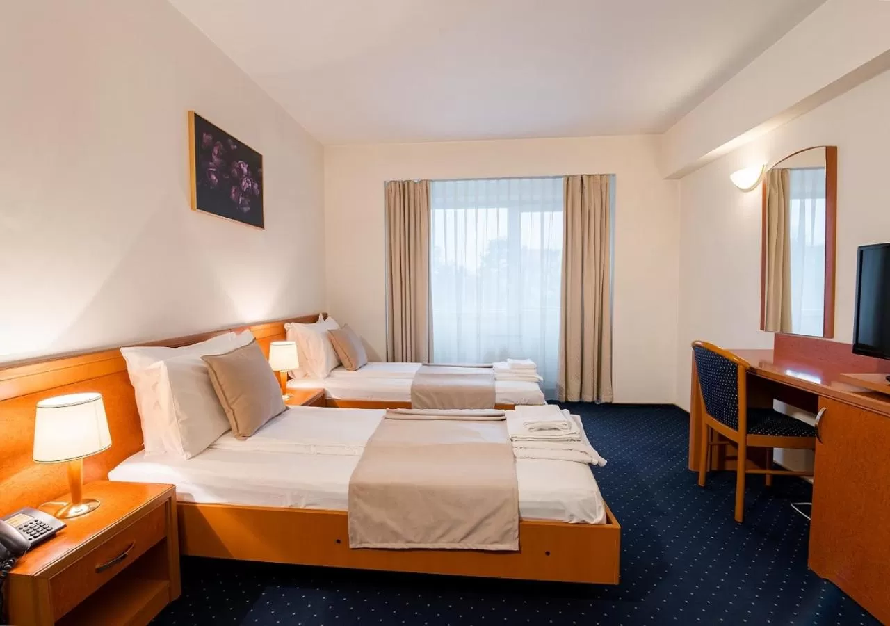 Bed in Hotel Excelsior By TimHotels