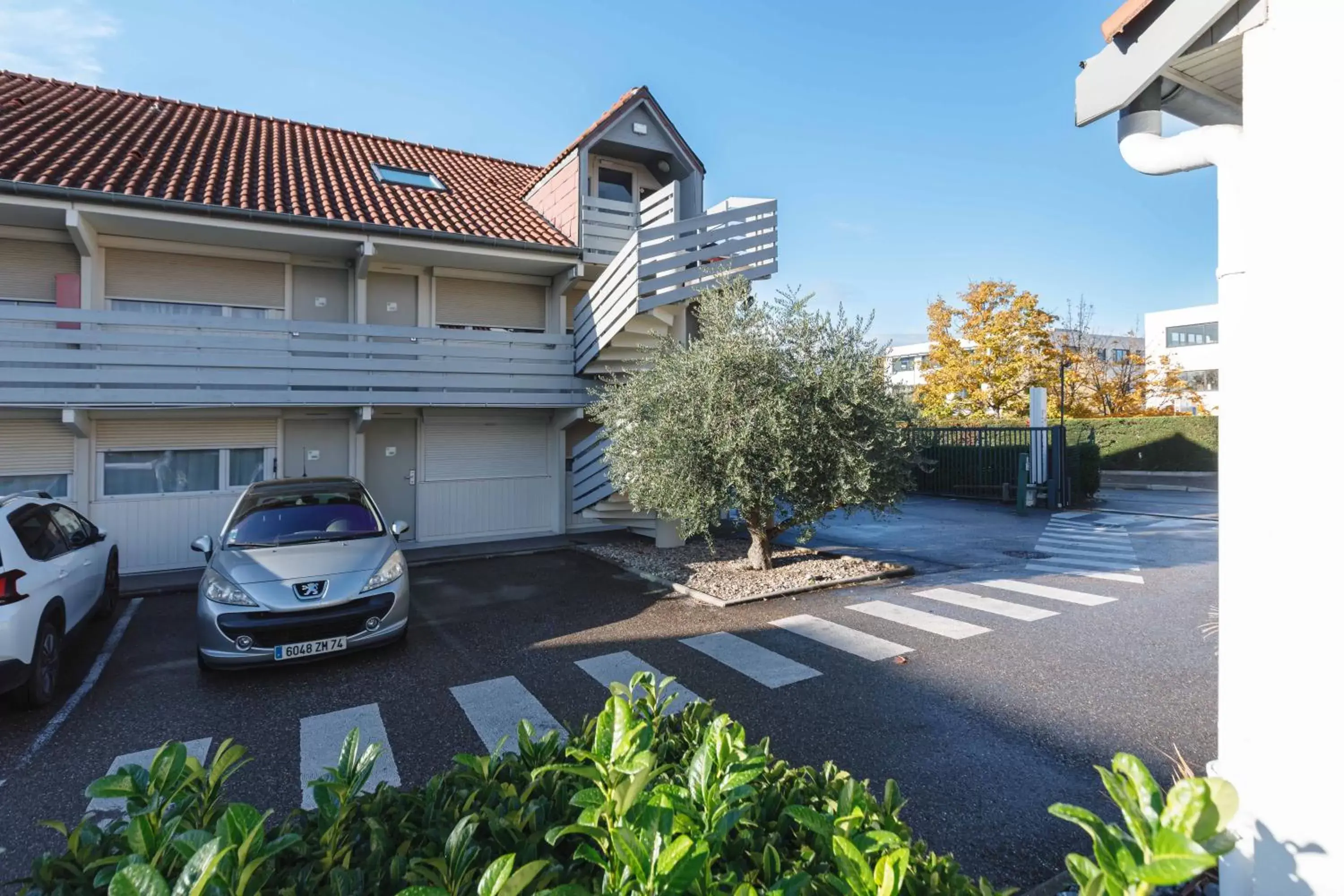 Parking, Property Building in Campanile Lyon Bron Eurexpo