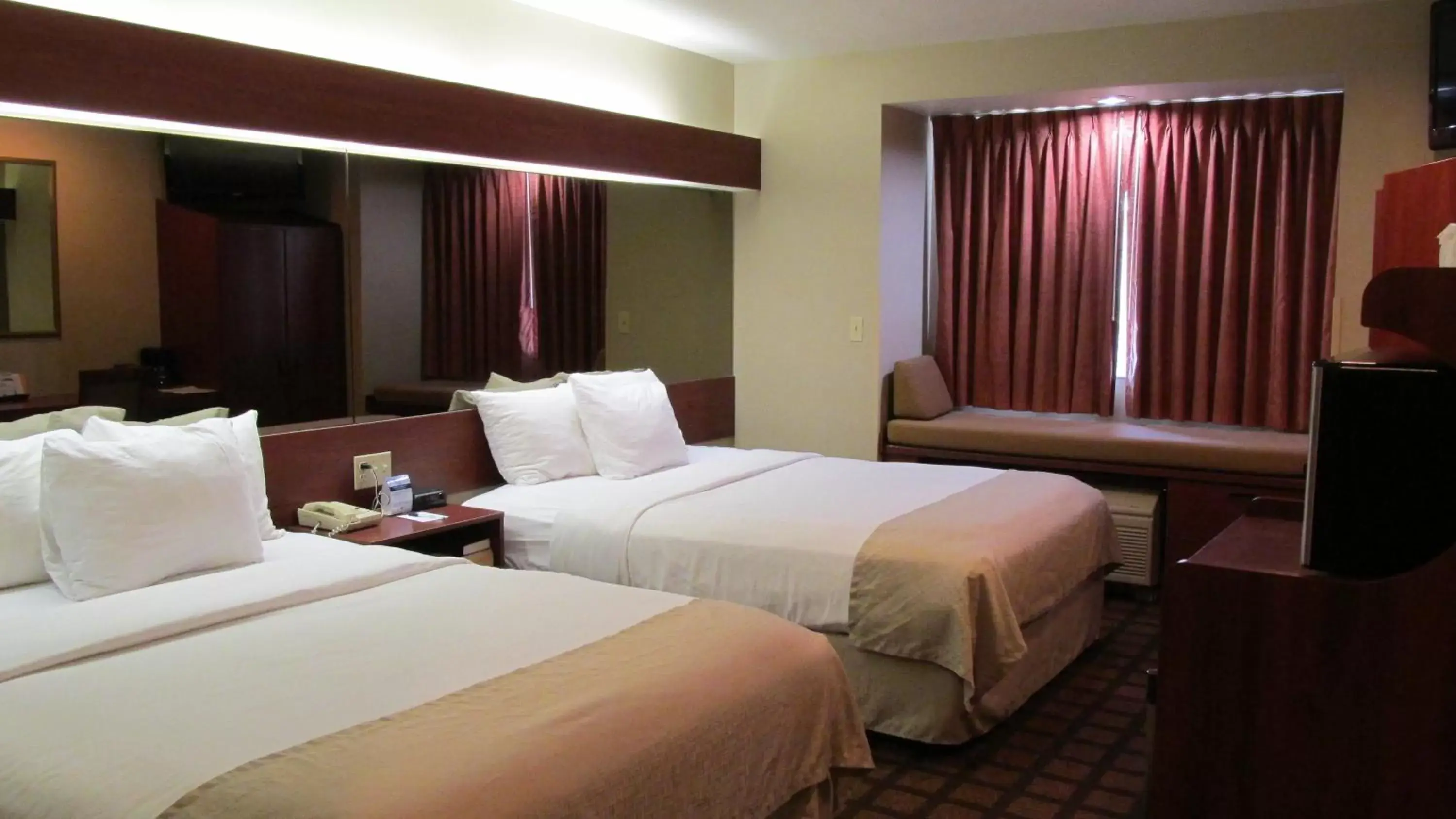 Bed in Microtel Inn & Suites by Wyndham Rapid City