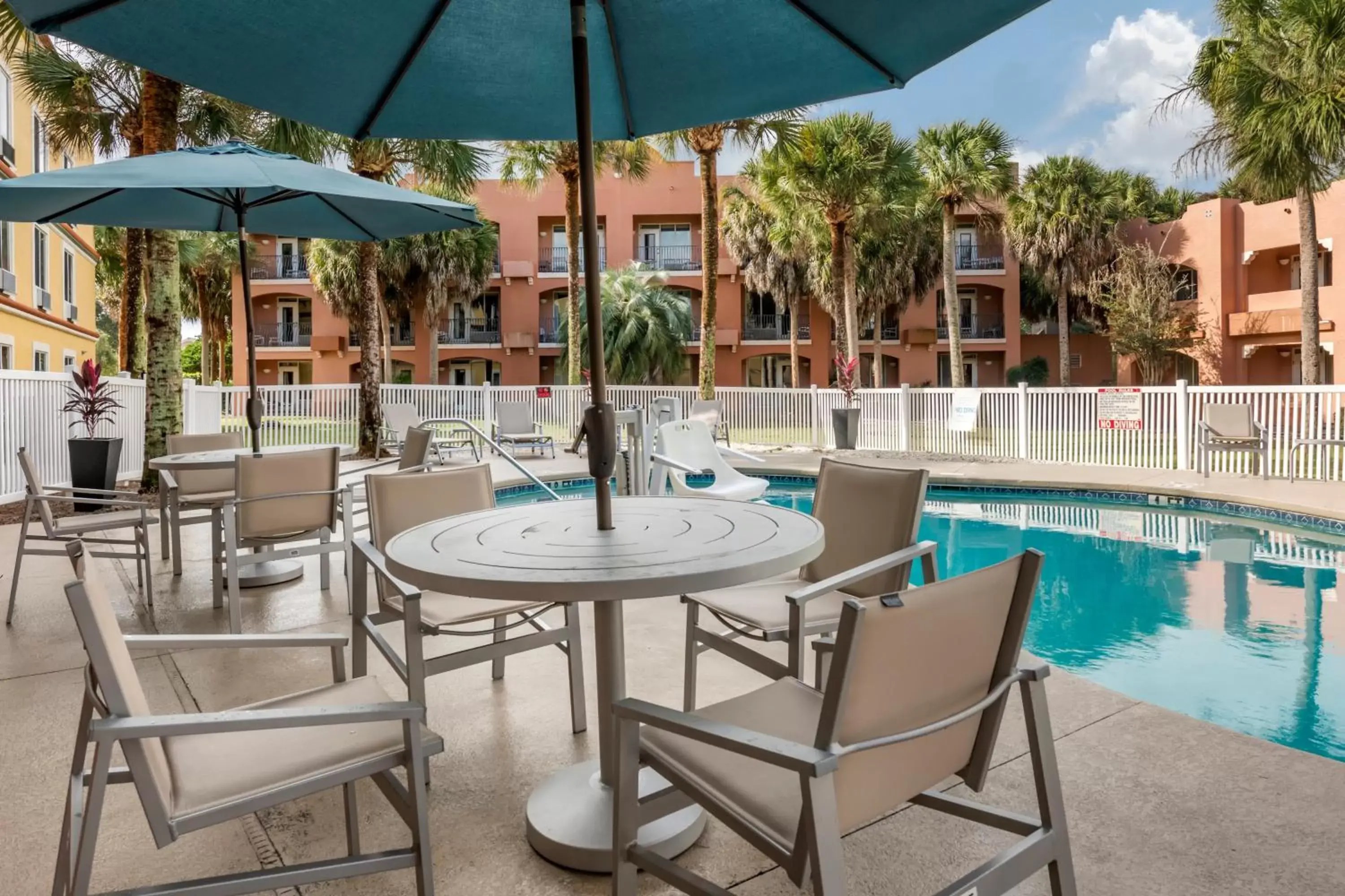 Patio, Swimming Pool in Holiday Inn Express Hotel & Suites - The Villages, an IHG Hotel