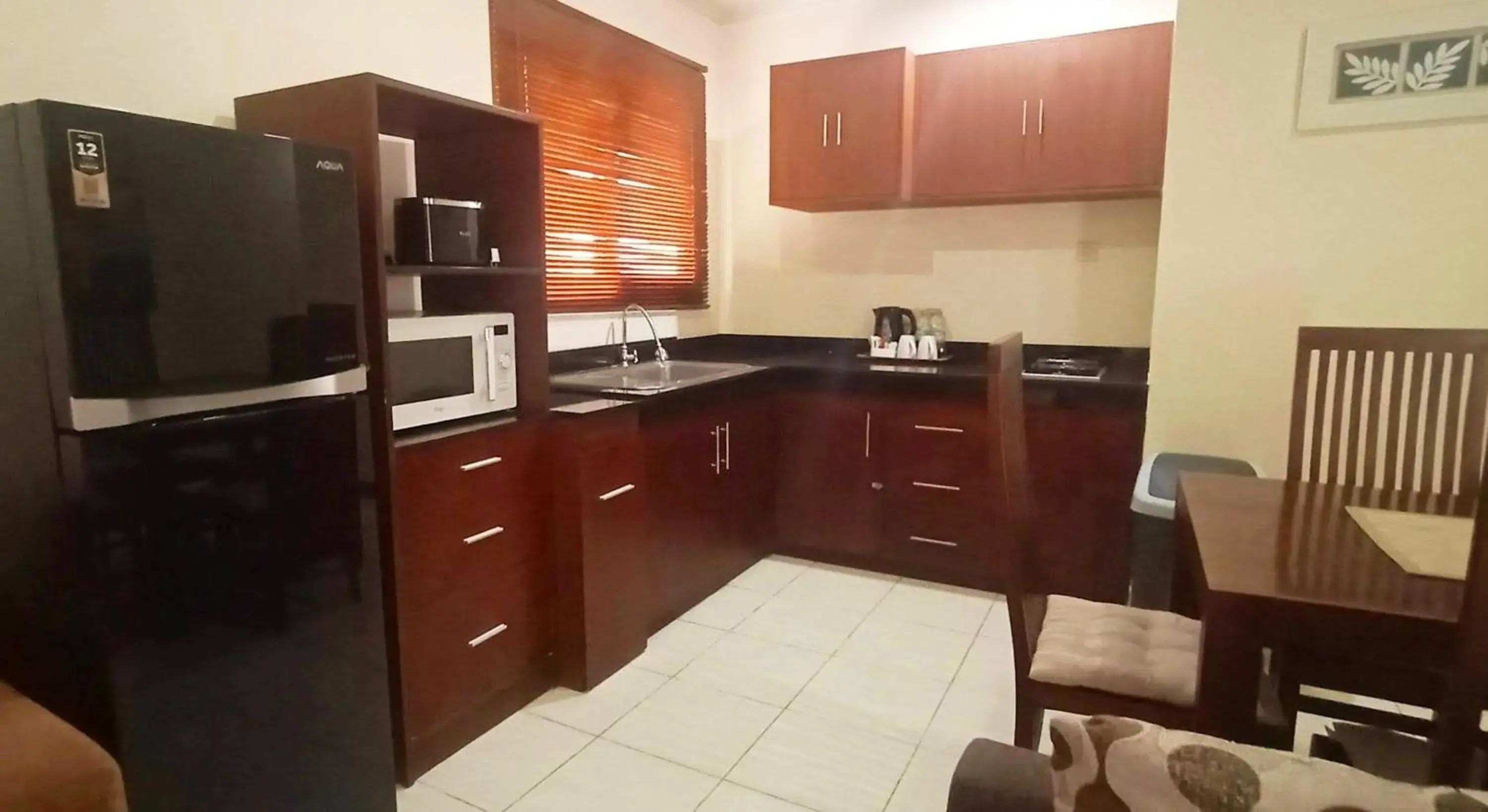 kitchen, Kitchen/Kitchenette in Sekuta Condo Suites