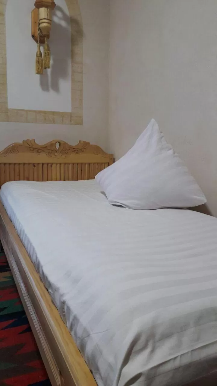 Bed in Zukhro Boutique Hotel