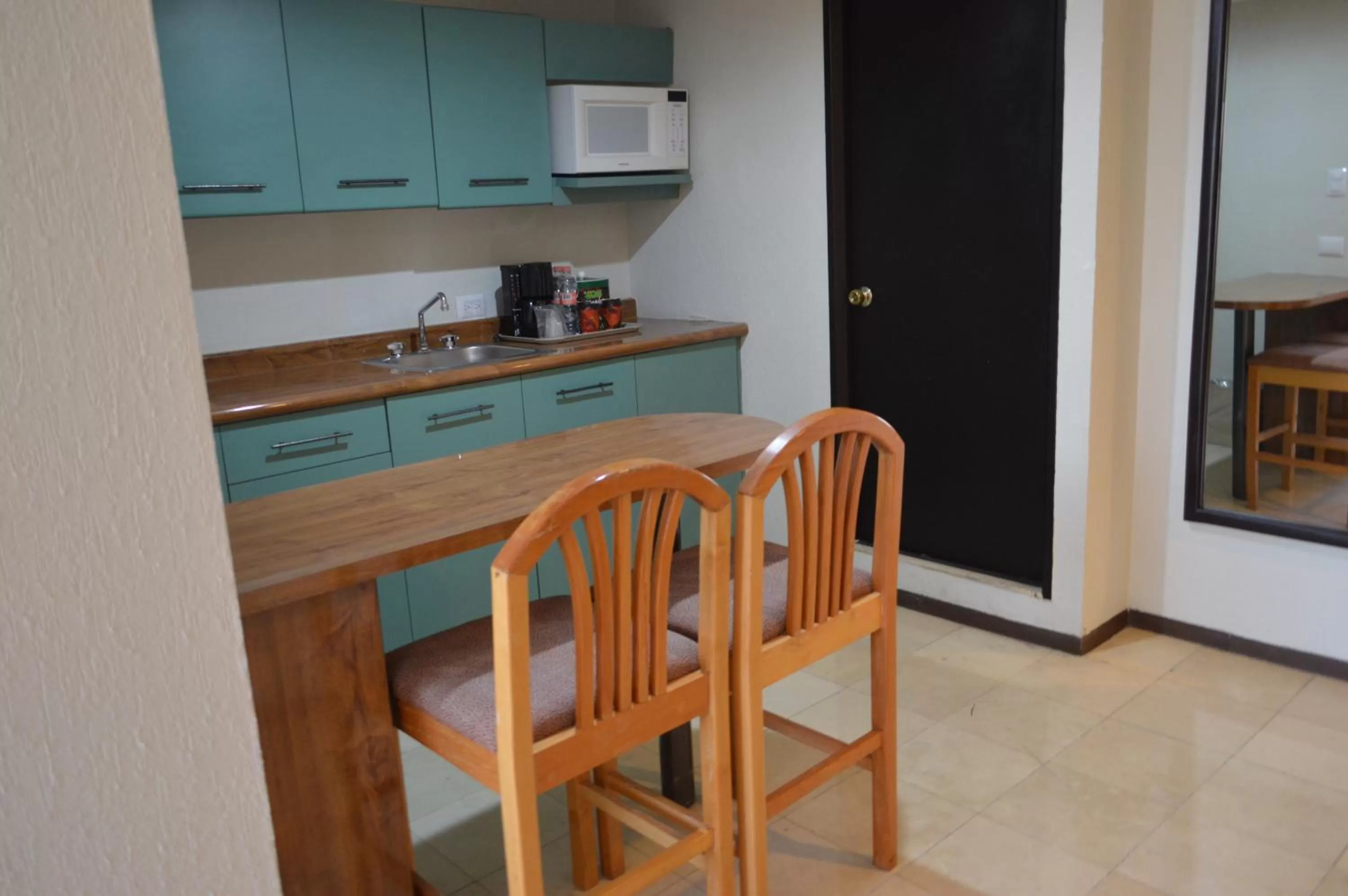 Kitchen or kitchenette in Ramada Hola Culiacan