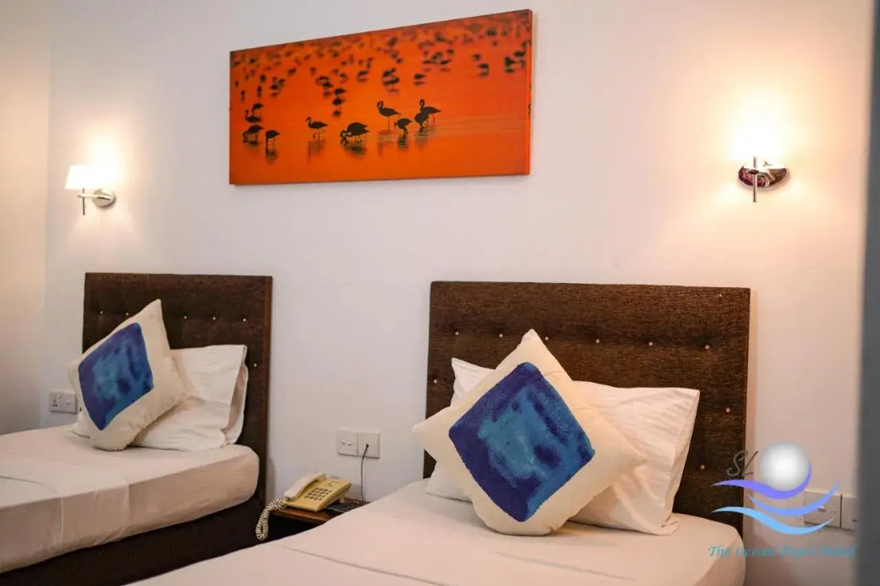 Bed in The Ocean Pearl Hotel Negombo