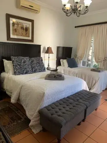 Bed in A Tapestry Garden Guest House Bed in A Tapestry Garden Guest House