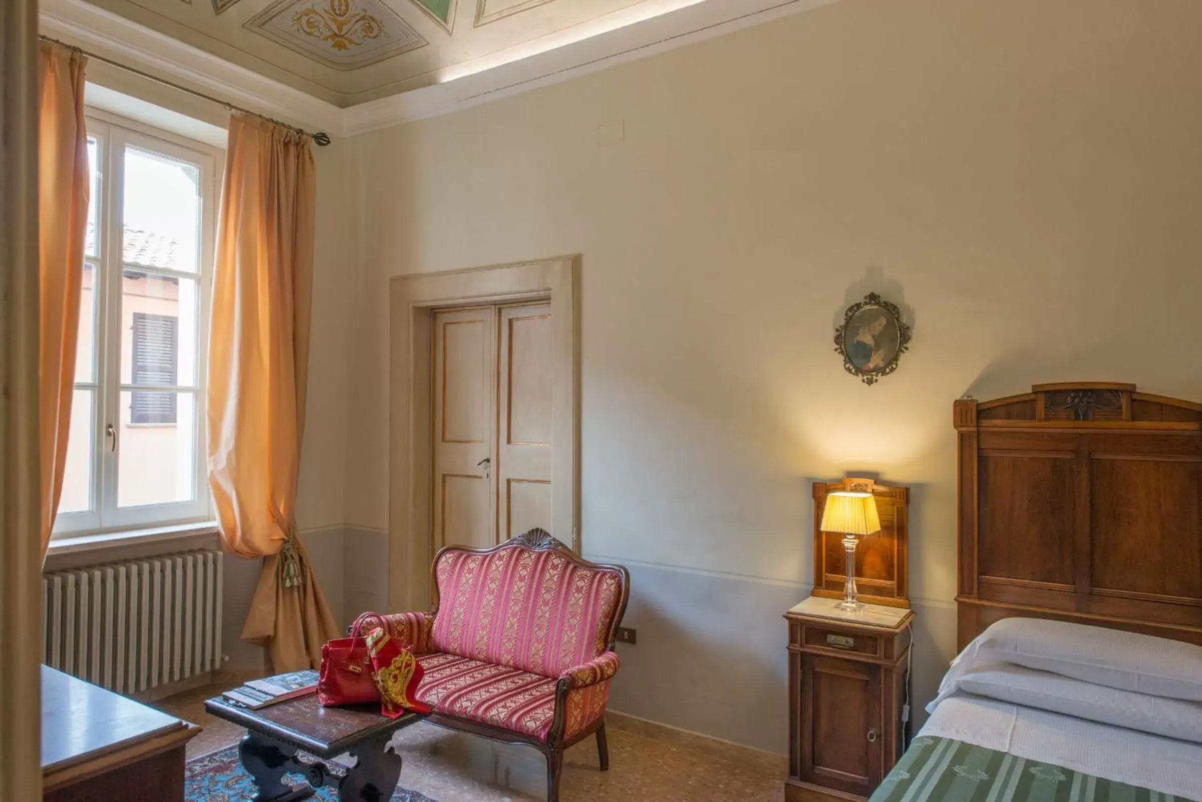 Bed, Seating Area in Palazzo Rotati