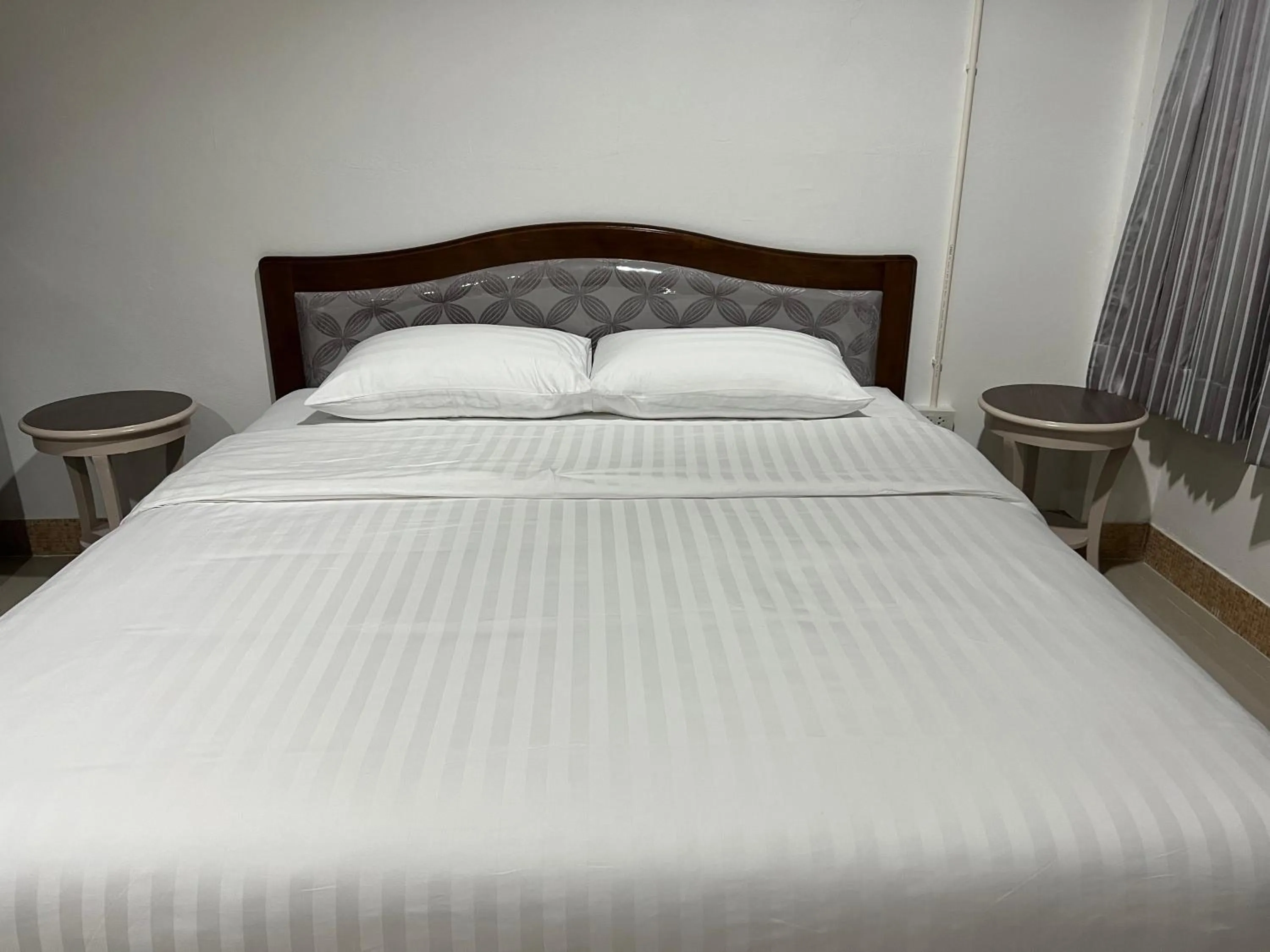 Bed in Mall Suites Hotel