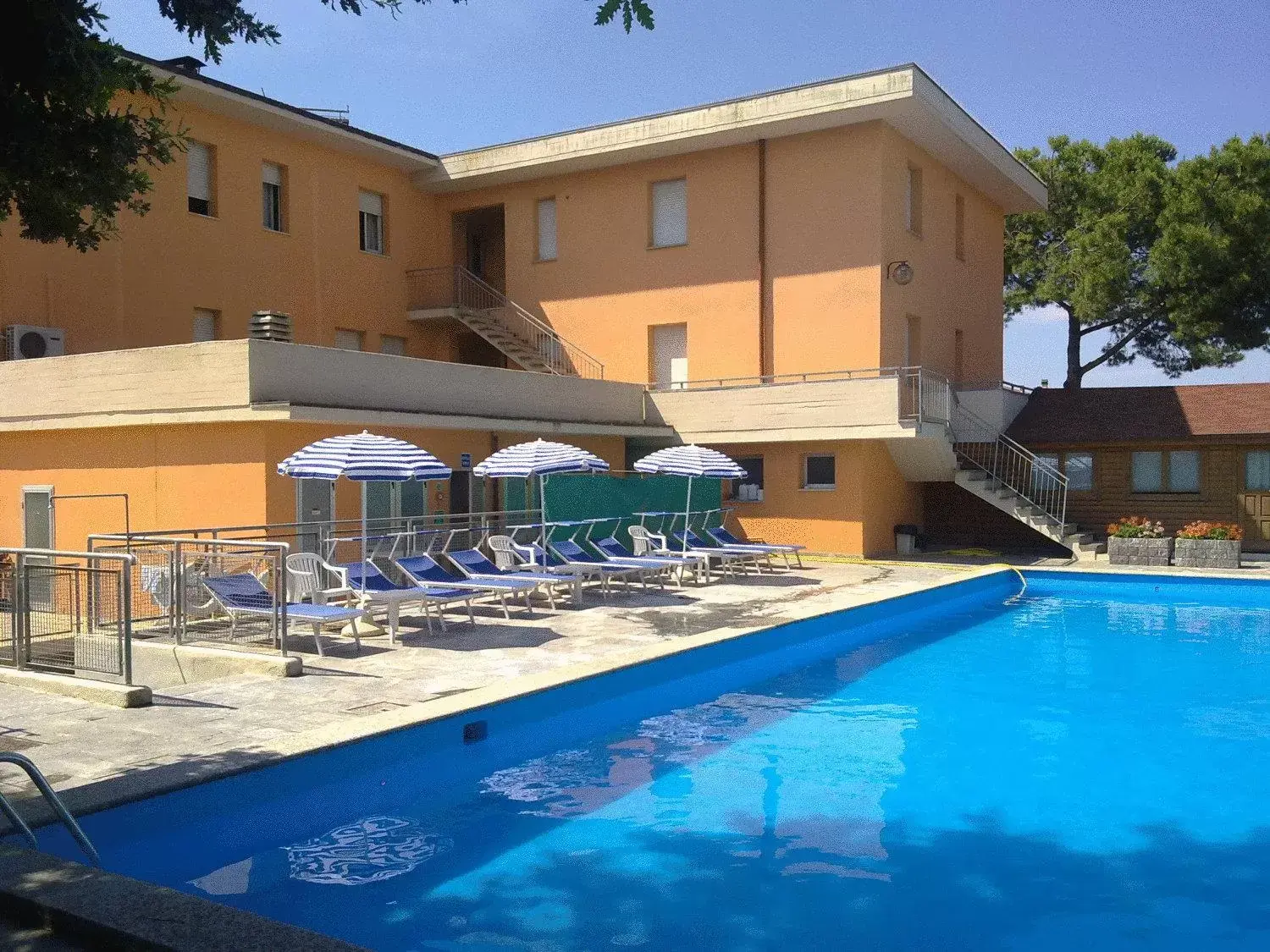 Pool view, Property Building in Hotel Trasimeno Bittarelli
