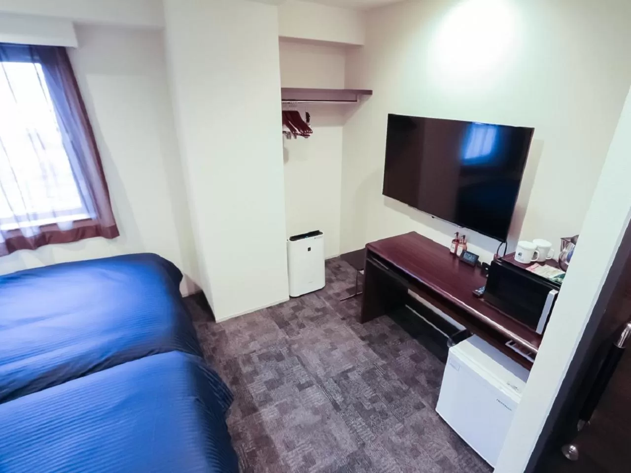 Bed in HOTEL LiVEMAX Niigata Ekimae