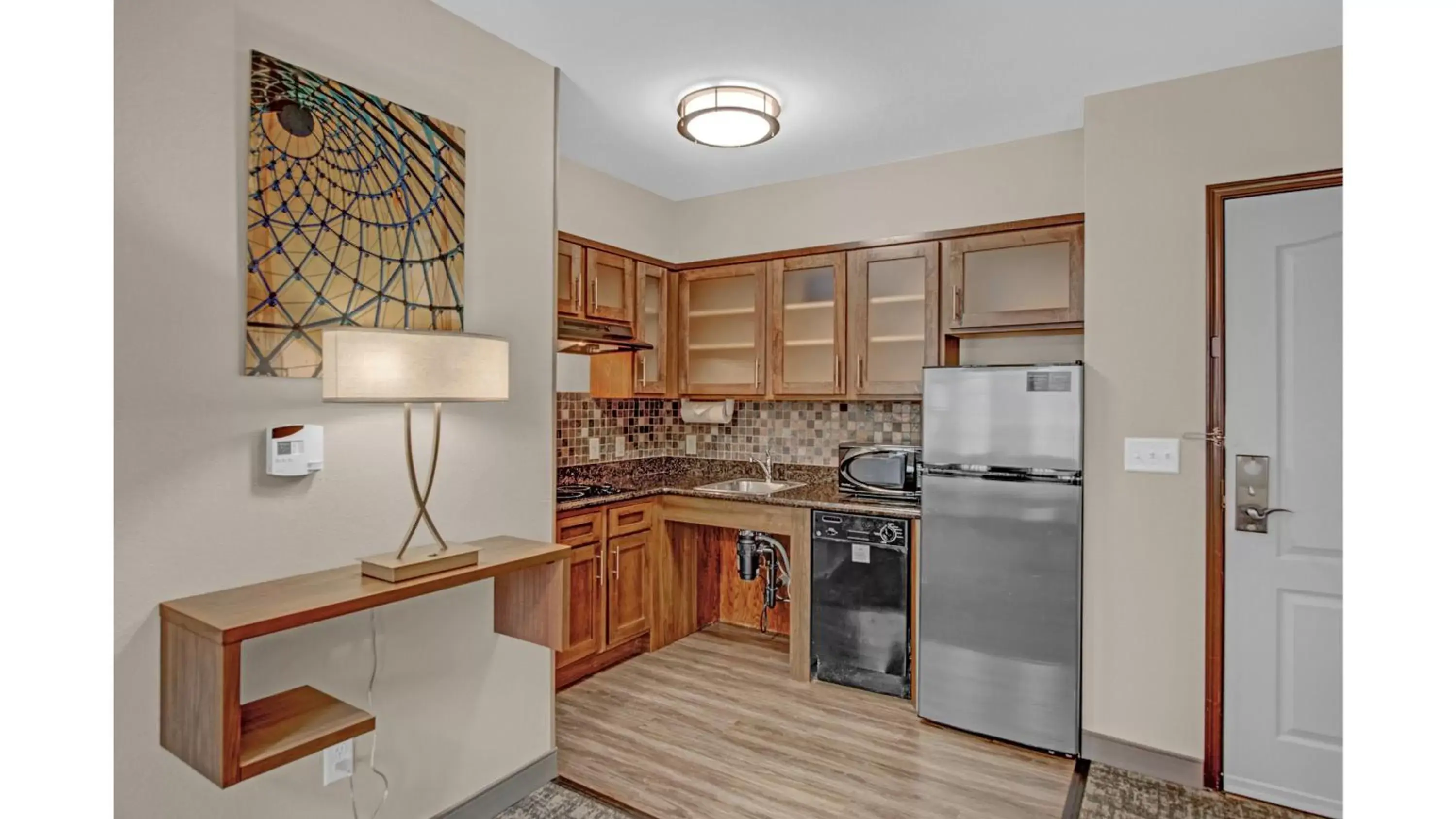 Photo of the whole room, Kitchen/Kitchenette in Staybridge Suites Salt Lake-West Valley City, an IHG Hotel