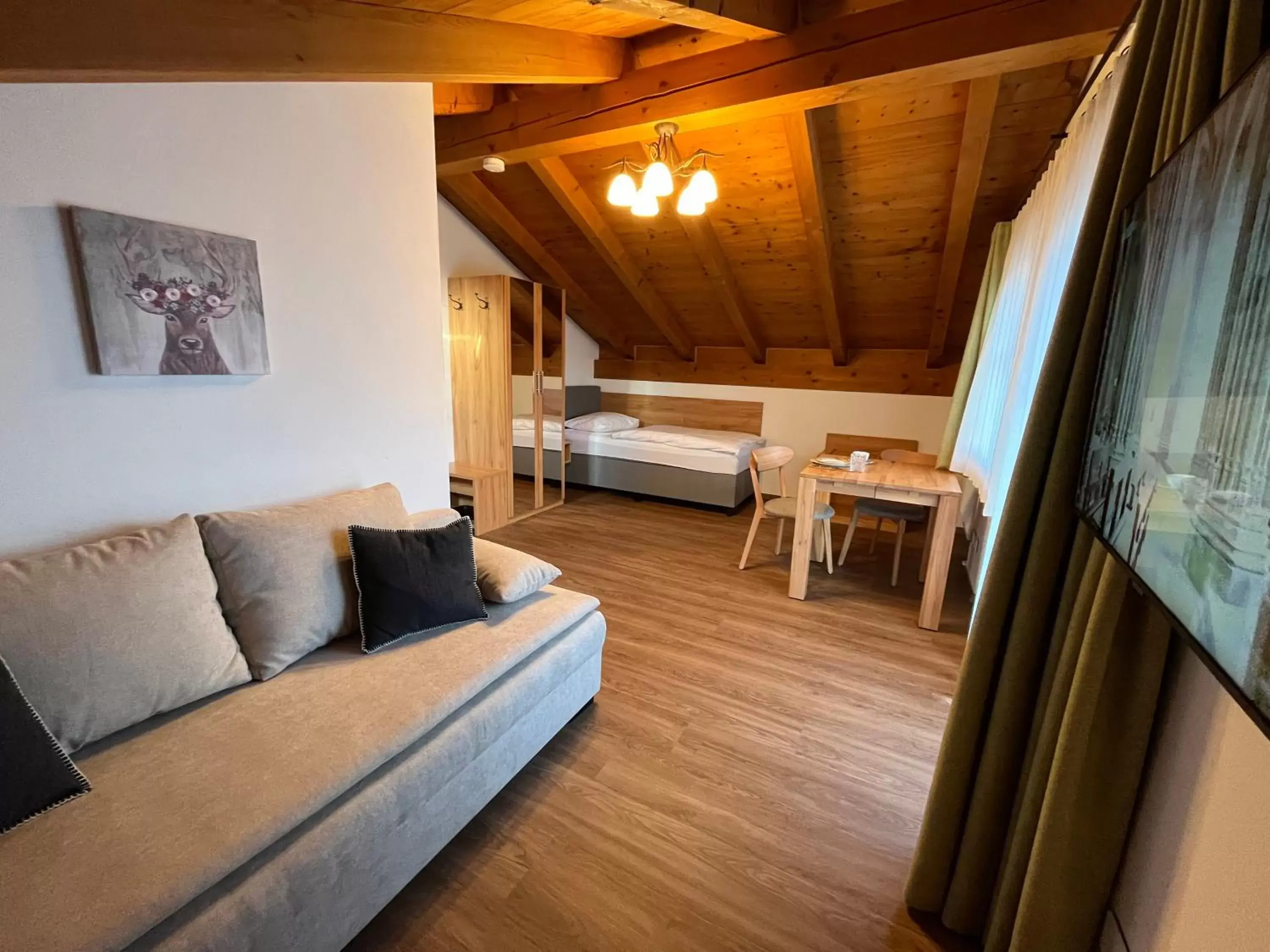 Bed, Seating Area in Hotel Garni Brunnthaler