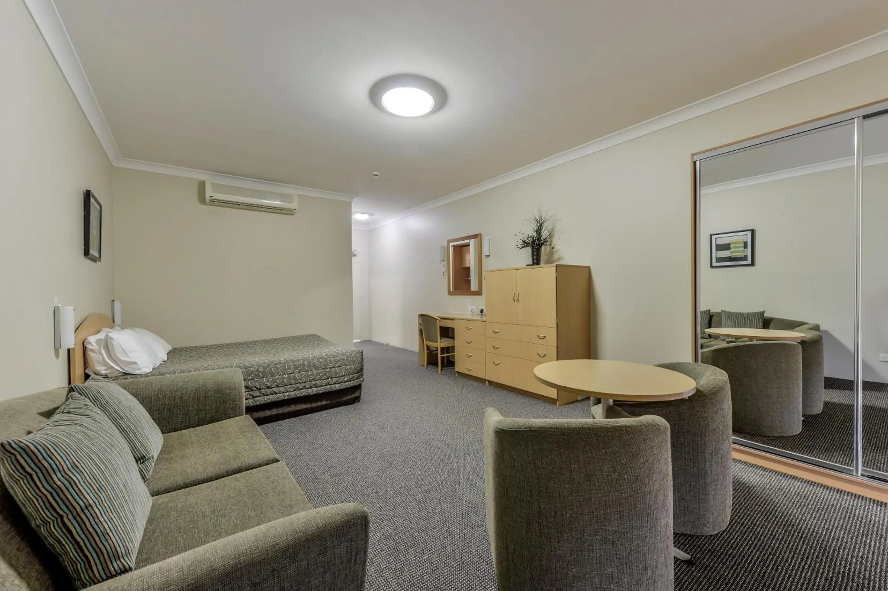 Photo of the whole room, Seating Area in Golden Guitar Motor Inn