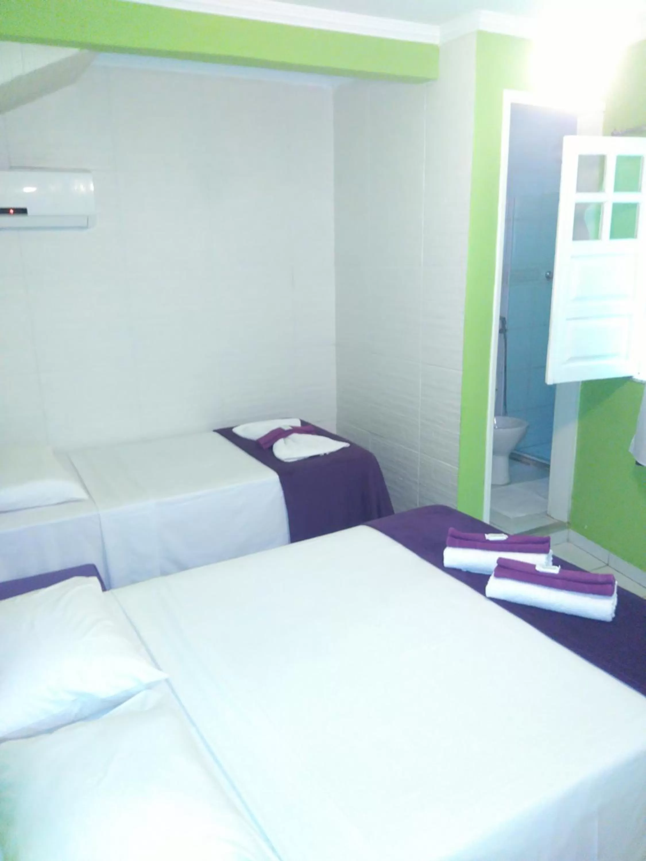 Bed in Hotel Pousada Papaya Verde