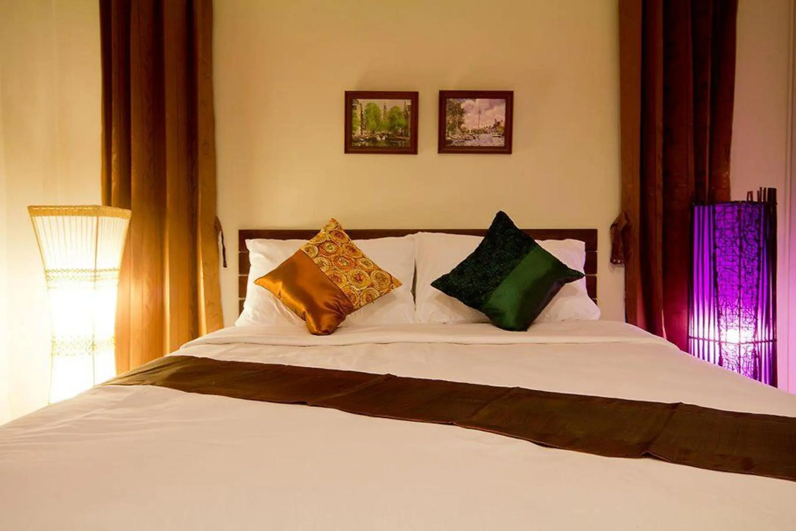 Bed in The Sylvana Pai Hotel