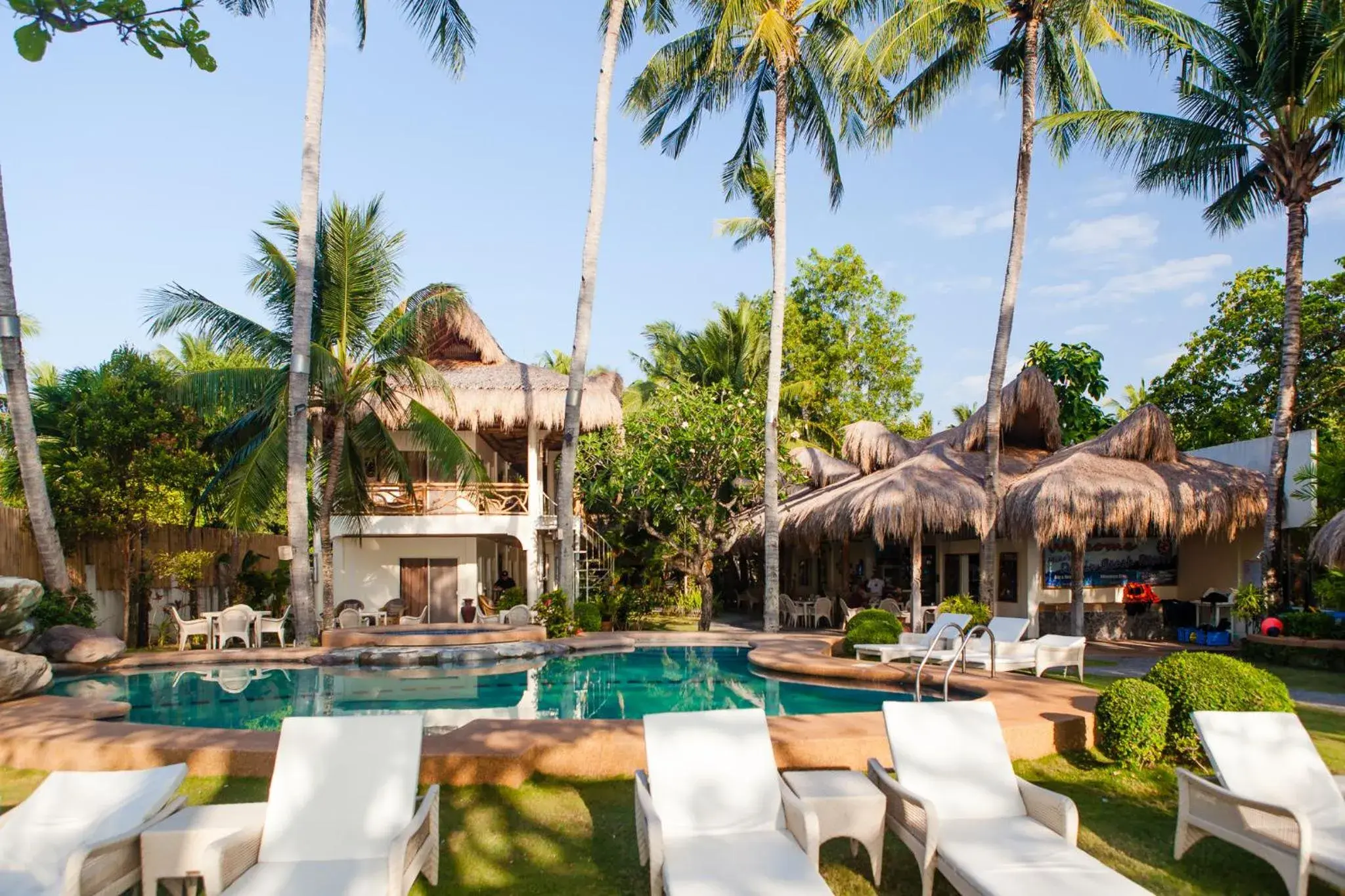 Day, Swimming Pool in Mike's Dauin Dive Resort