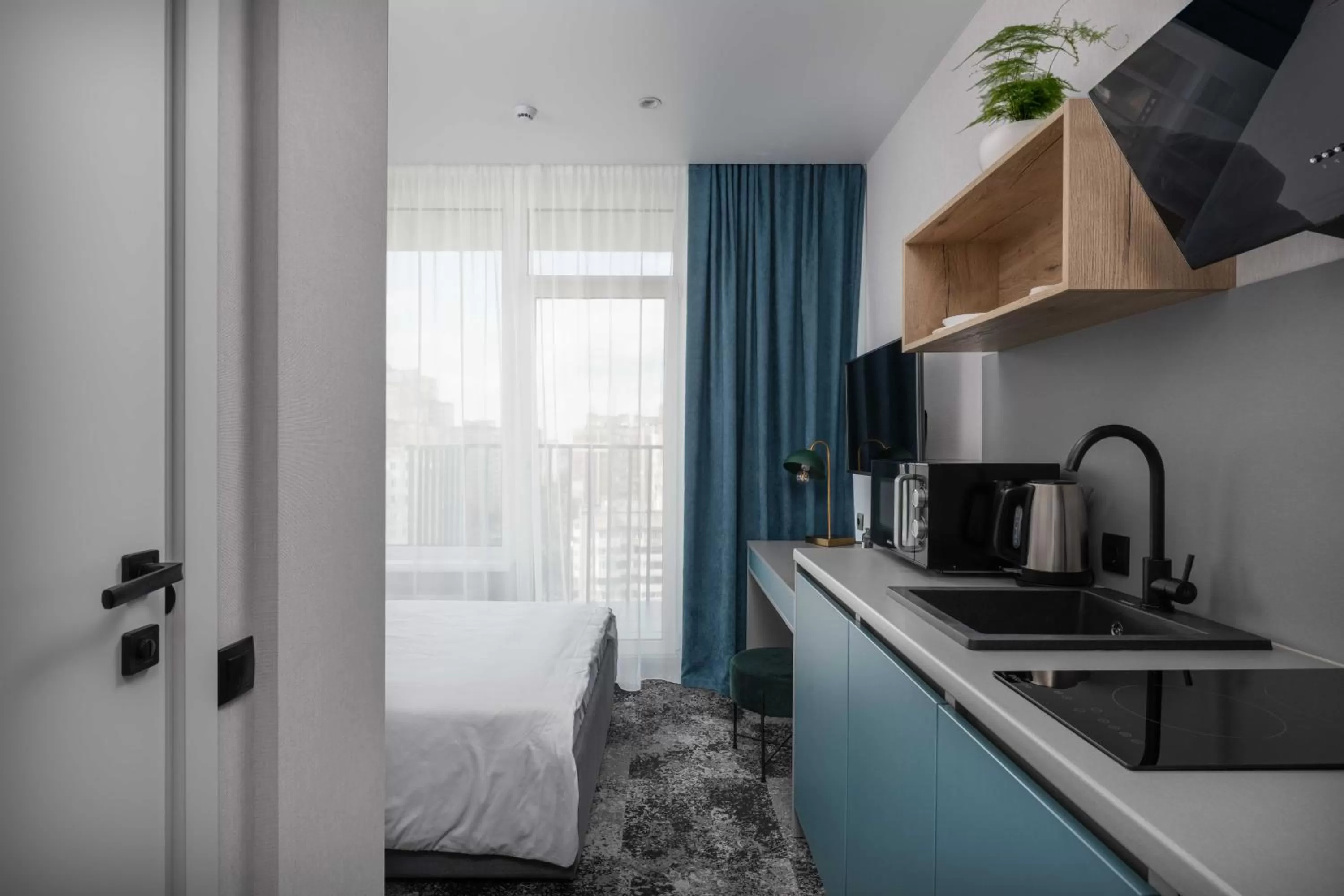 Bed, Kitchen/Kitchenette in Be The One Hotel