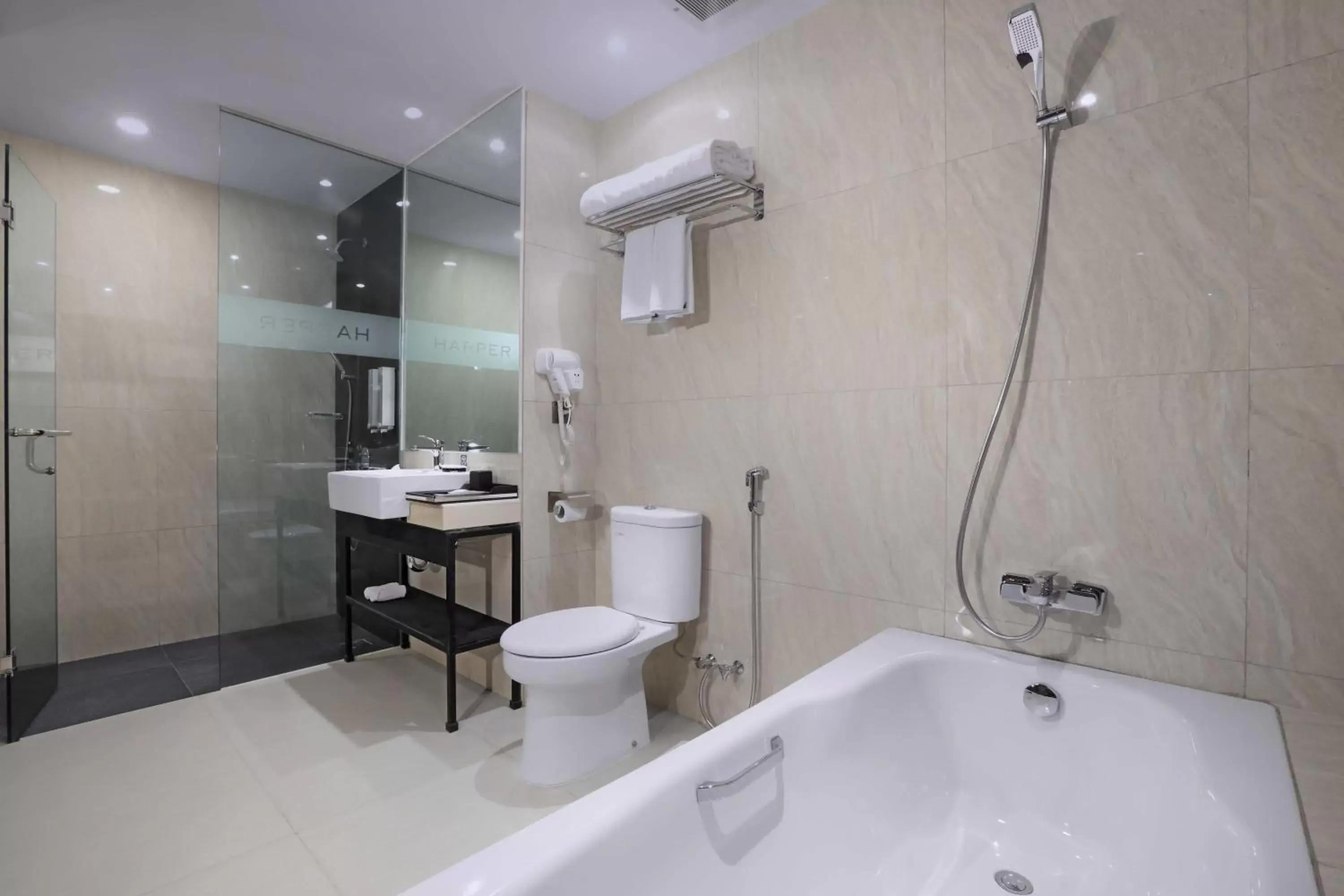 Bathroom in Harper Wahid Hasyim Medan by ASTON