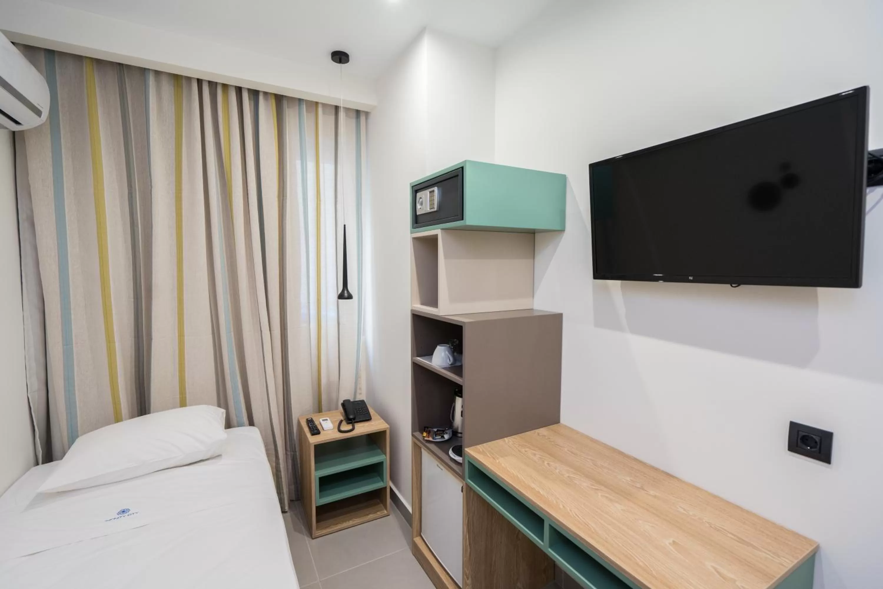 Bed in Infinity City Boutique Hotel