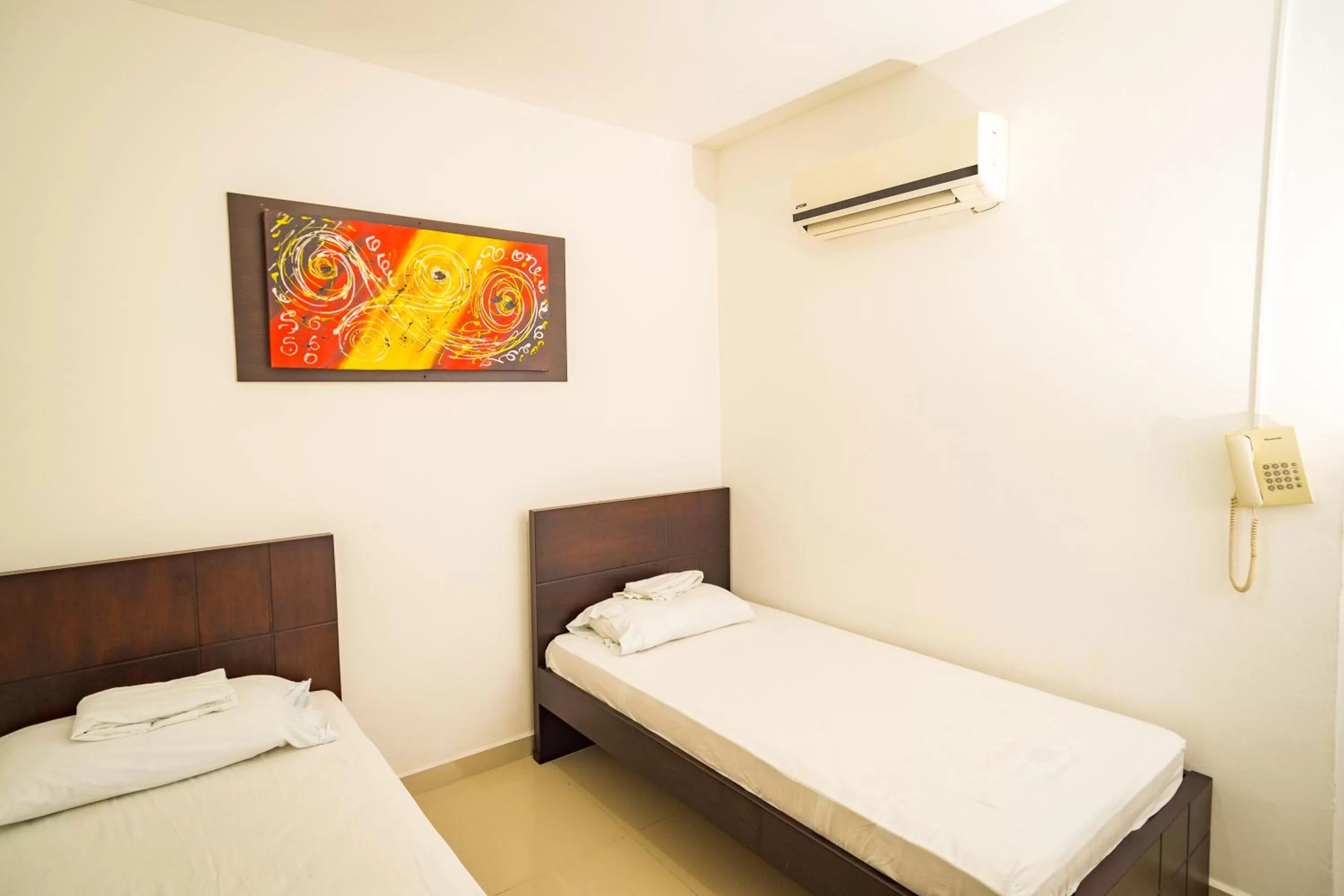 Bed in Genesis Hotel