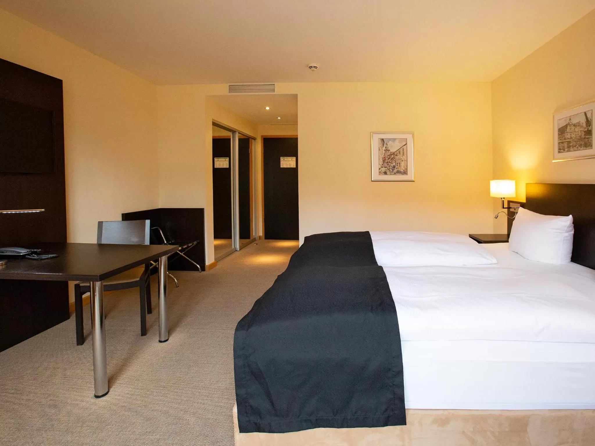 Photo of the whole room, Bed in DORMERO Hotel Altes Kaufhaus Lüneburg